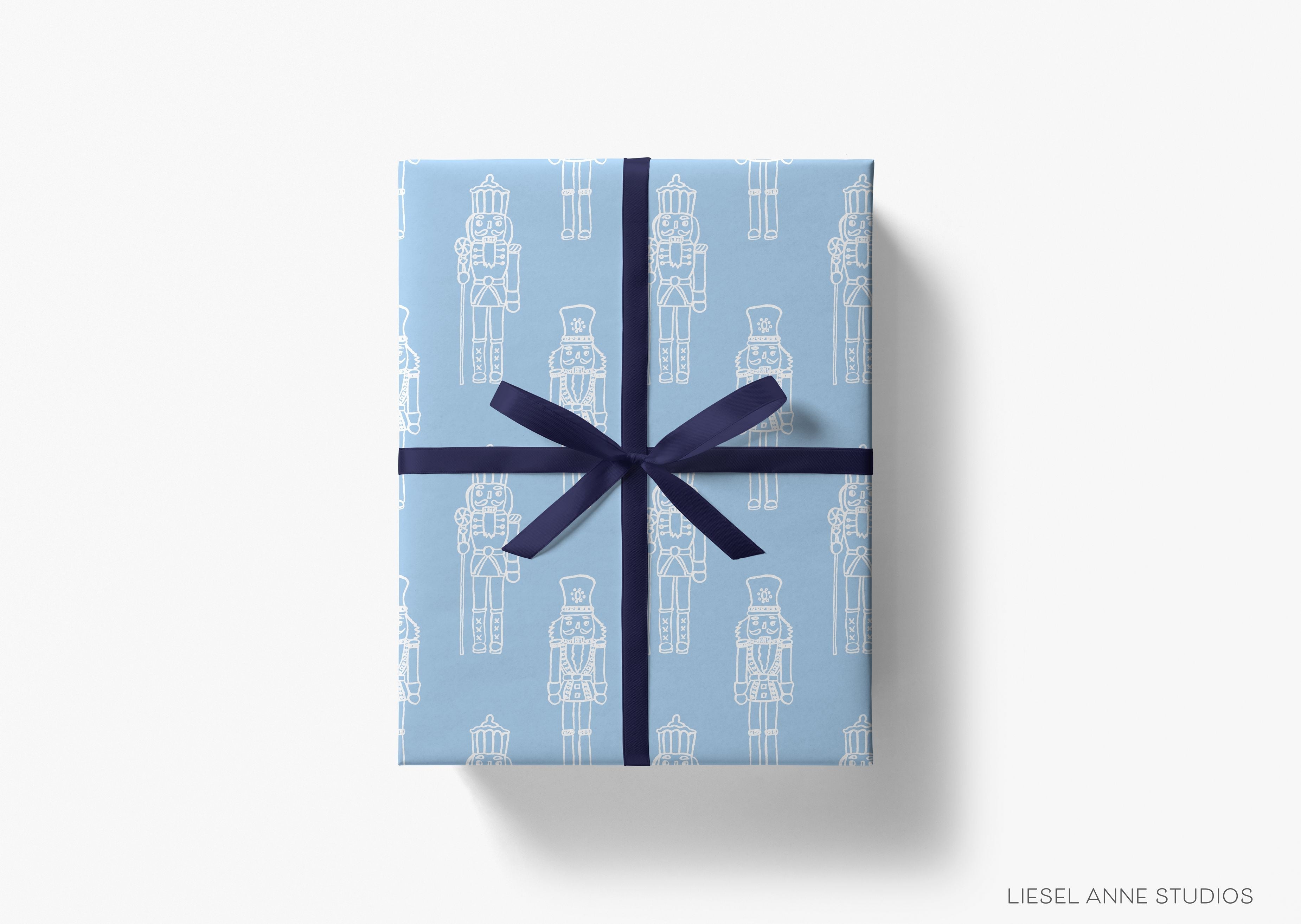 Blue Nutcracker Christmas Gift Wrap-This matte finish gift wrap features our hand-painted watercolor nutcrackers. It makes a perfect wrapping paper for a holiday present. -The Singing Little Bird