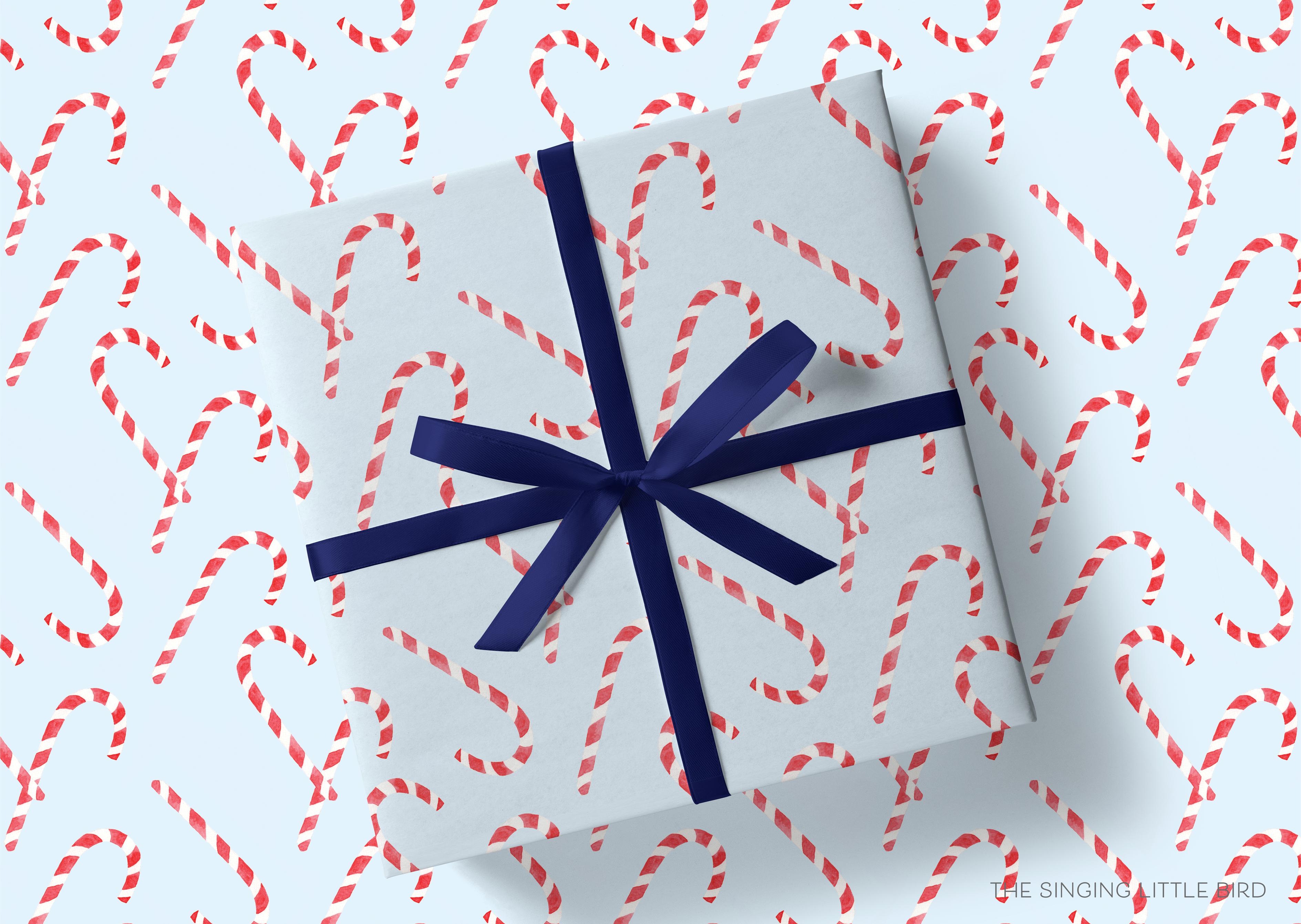 Candy Cane Light Blue Christmas Gift Wrap-This matte finish gift wrap features our hand-painted watercolor gingerbread candy canes. It makes a perfect wrapping paper for a holiday present. -The Singing Little Bird