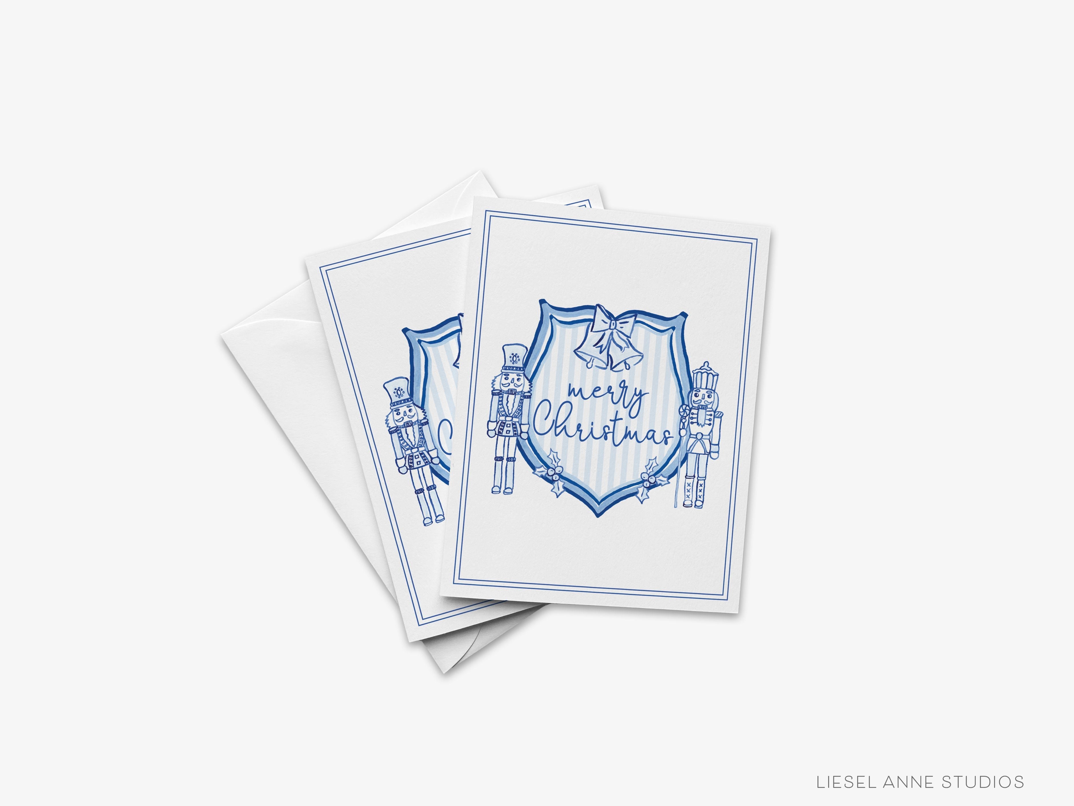 Christmas Crest Blue and White Cards-These folded greeting cards are 4.25x5.5 and feature our hand-painted Nutcracker Crest, printed in the USA on 100lb textured stock. They come with a White envelope and make a great Christmas card for the holiday lover in your life.-The Singing Little Bird