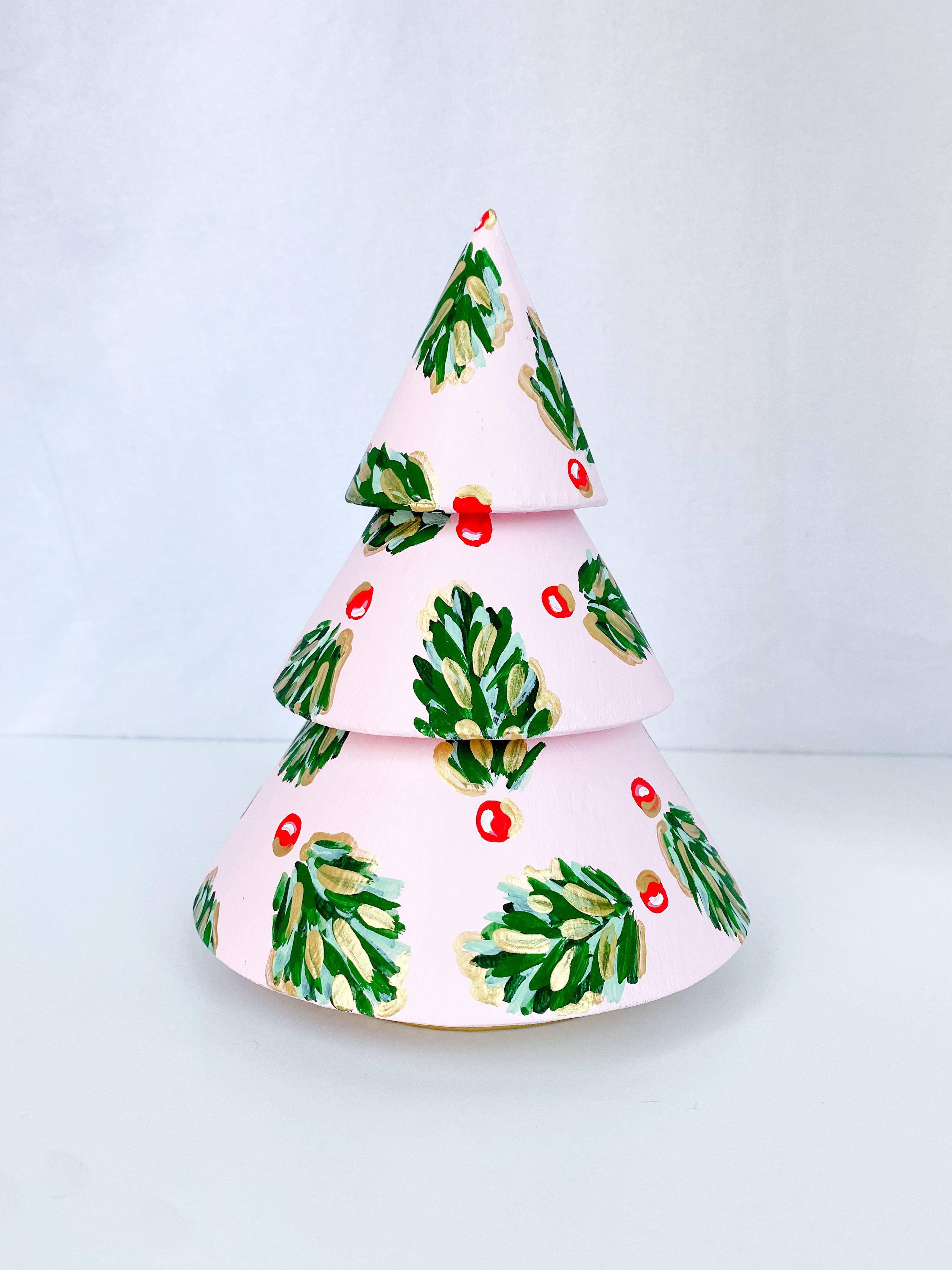 Frosty Pink Golden Holly Mini Tree - Short-Hand-Painted Mini Christmas Tree | Measures 7.5" tall and approx. 5.5" wide | Features the Golden Holly design with a pale pink base and shimmery gold accents and gold trunk | Light-weight and non-breakable paper mache tree | Coated with a protective matte finish that will keep it shimmering year after year | Each tree is slightly different with potential small imperfections due to the hand-painted nature, making each one special and unique!-The Singing Little Bird