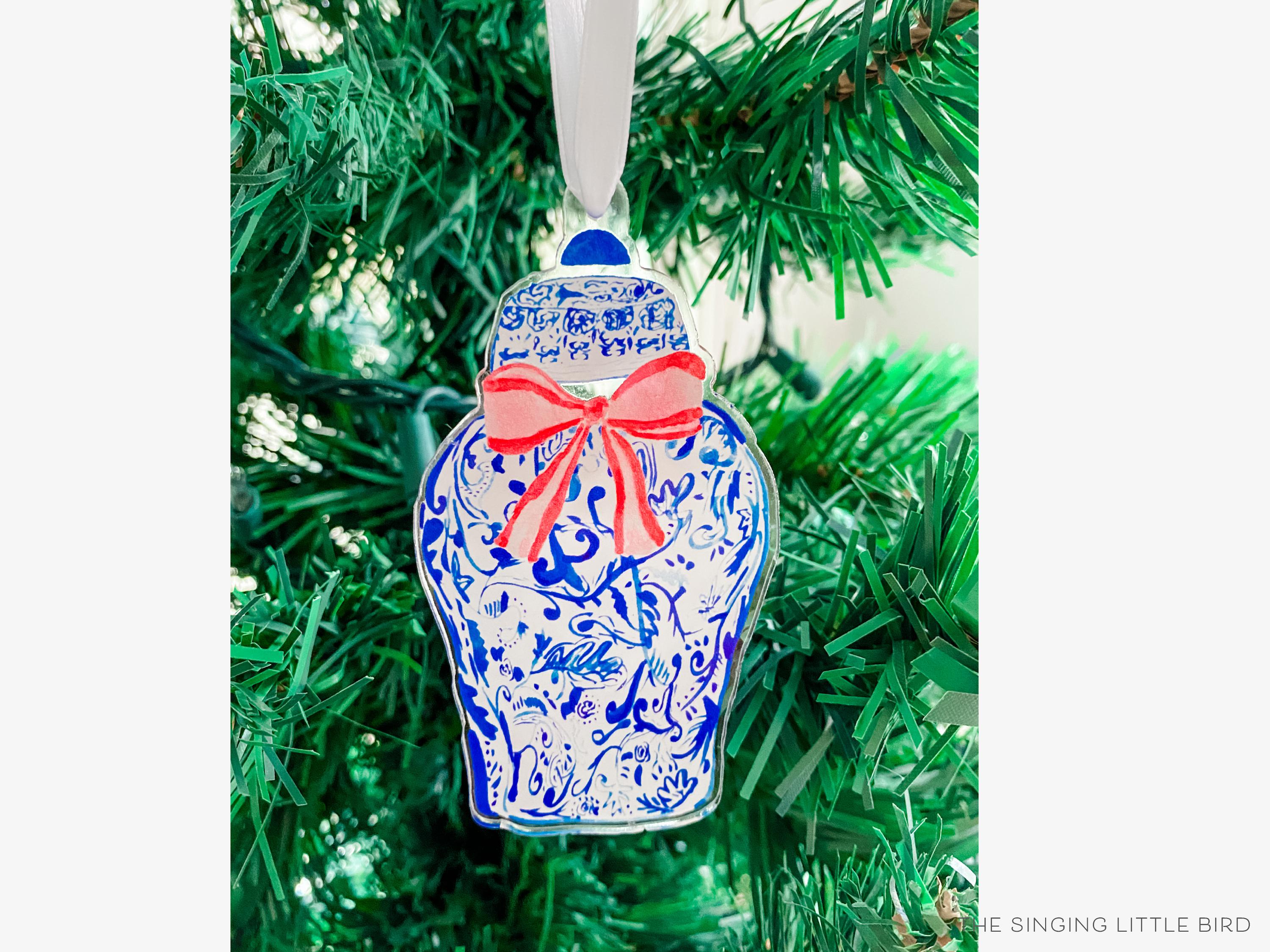 Ginger Jar Acrylic Ornament-These acrylic ornaments feature our hand-painted watercolor ginger jar and red bow. They include a white silk ribbon and measure approximately 4" on its longest side, making a great addition to your Christmas tree or gift for the chinoiserie lover in your life.-The Singing Little Bird