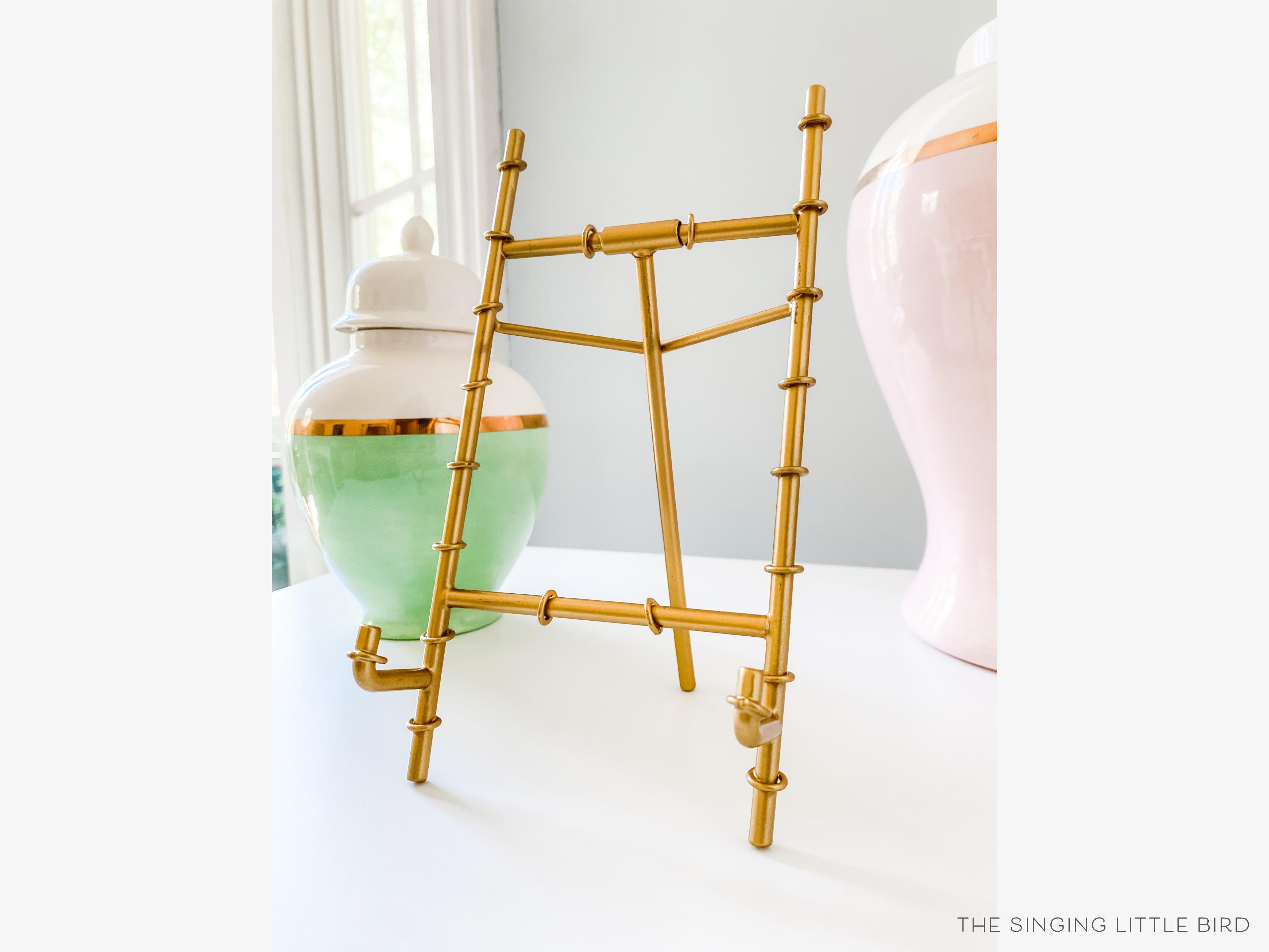 Gold Bamboo Easel-• Gold Metal Bamboo Easel
• Makes for a great display stand for calendars and 5x7 Art Prints
• Measures 4" wide x 8" tall-The Singing Little Bird