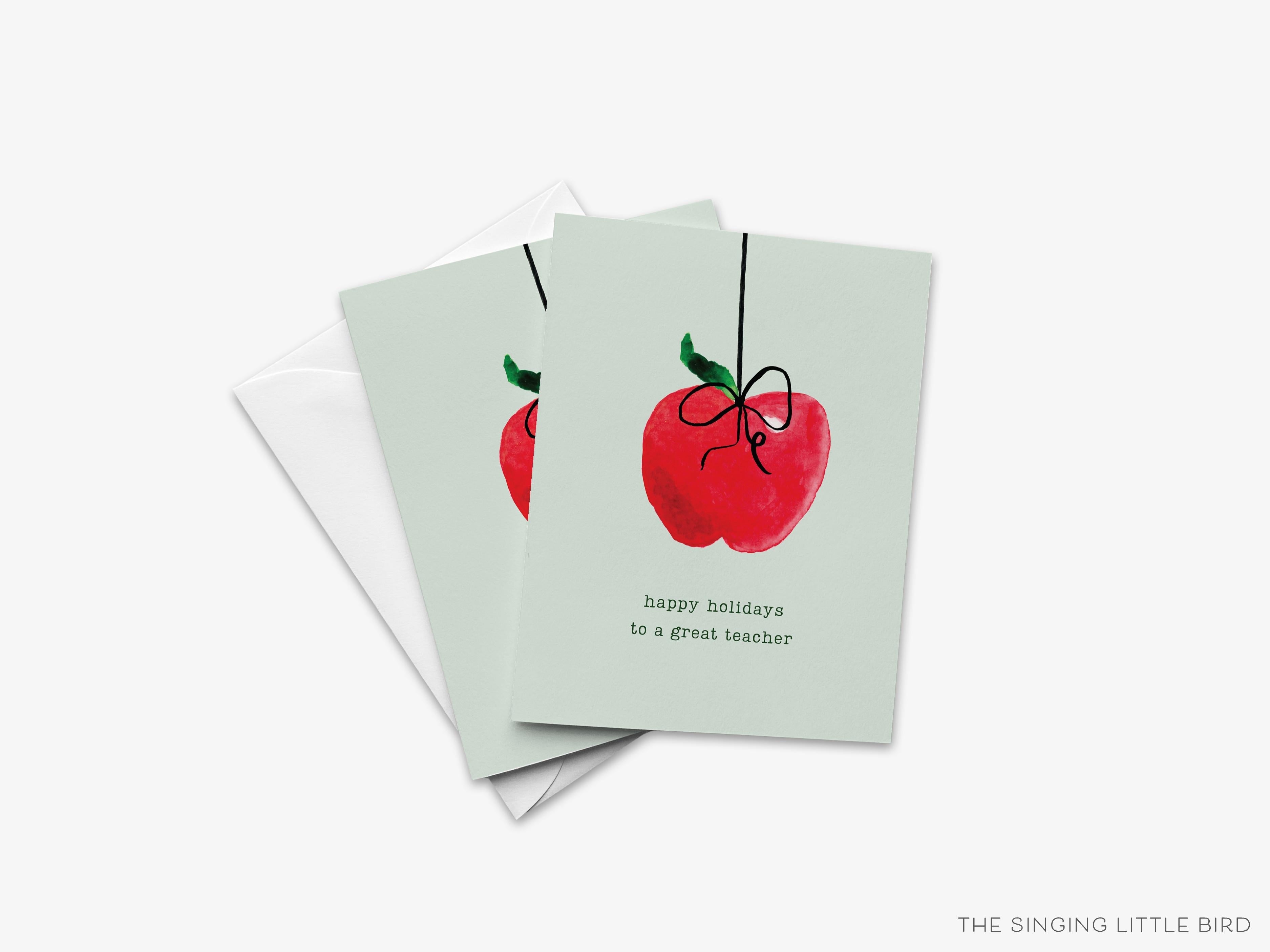 Happy Holidays To A Great Teacher Greeting Card-These folded greeting cards are 4.25x5.5 and feature our hand-painted apple, printed in the USA on 100lb textured stock. They come with a White envelope and make a great happy holidays card for the educator lover in your life.-The Singing Little Bird