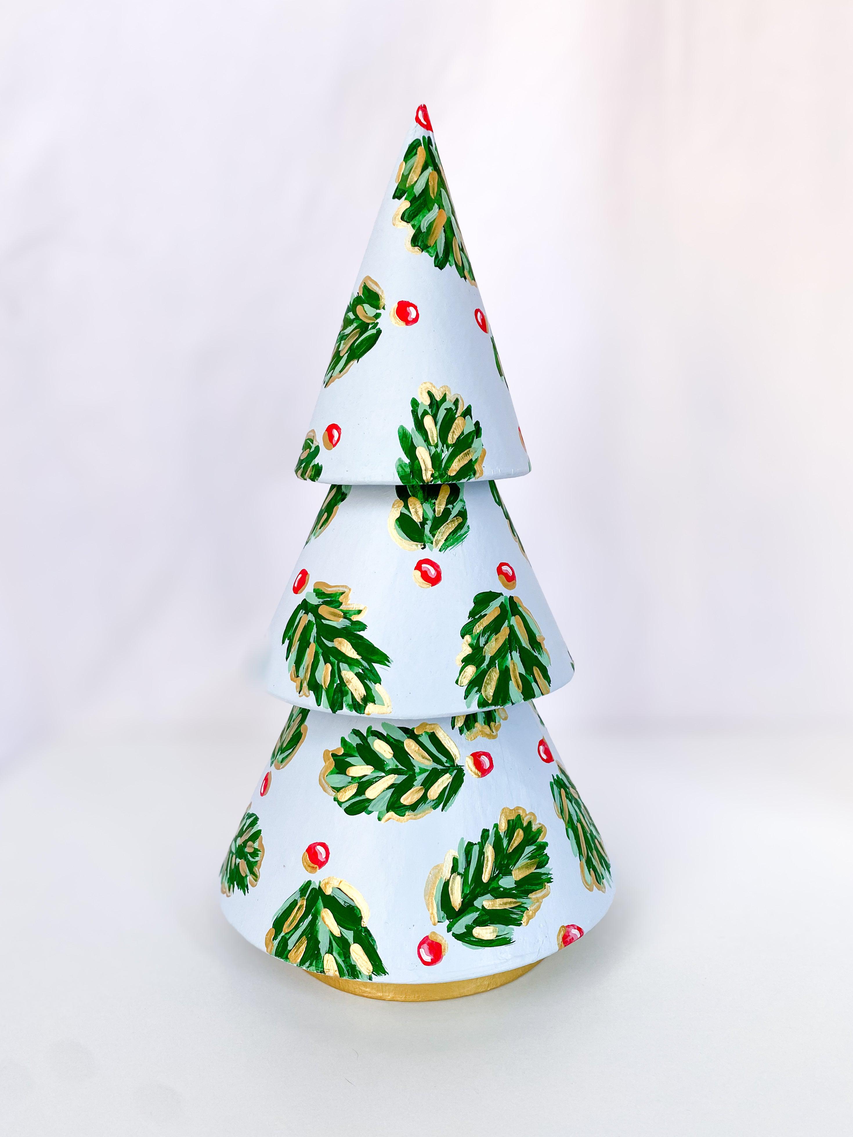 Icy Blue Golden Holly Mini Tree - Tall-Hand-Painted Mini Christmas Tree | Measures 12" tall and approx. 6" wide | Features the Golden Holly design with a light blue base and shimmery gold accents and gold trunk | Light-weight and non-breakable paper mache tree | Coated with a protective matte finish that will keep it shimmering year after year | Each tree is slightly different with potential small imperfections due to the hand-painted nature, making each one special and unique!-The Singing Little Bird