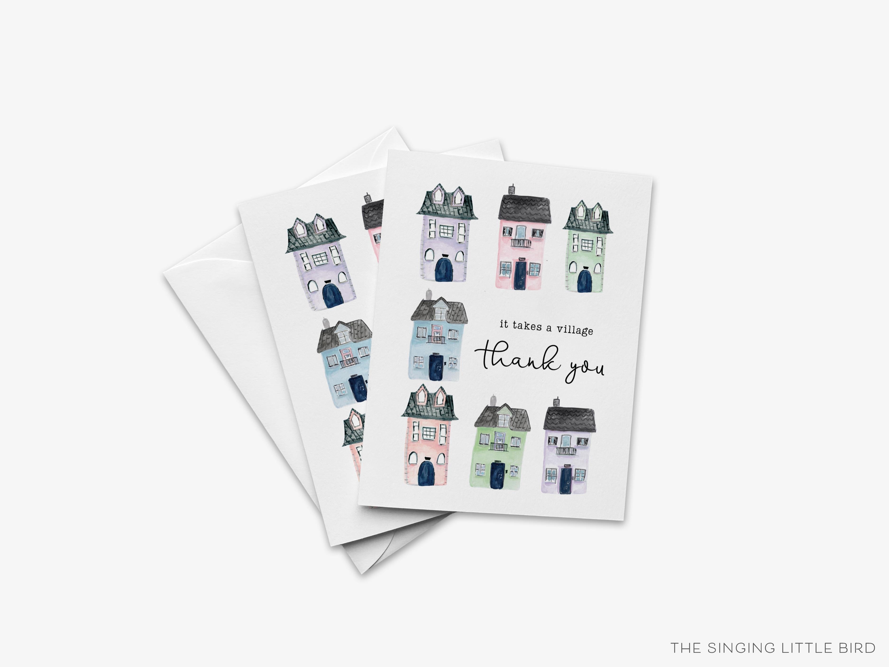 It Takes a Village Greeting Card-These folded greeting cards are 4.25x5.5 and feature our hand-painted houses, printed in the USA on 100lb textured stock. They come with a White envelope and make a great thank you card for the supportive person in your life.-The Singing Little Bird