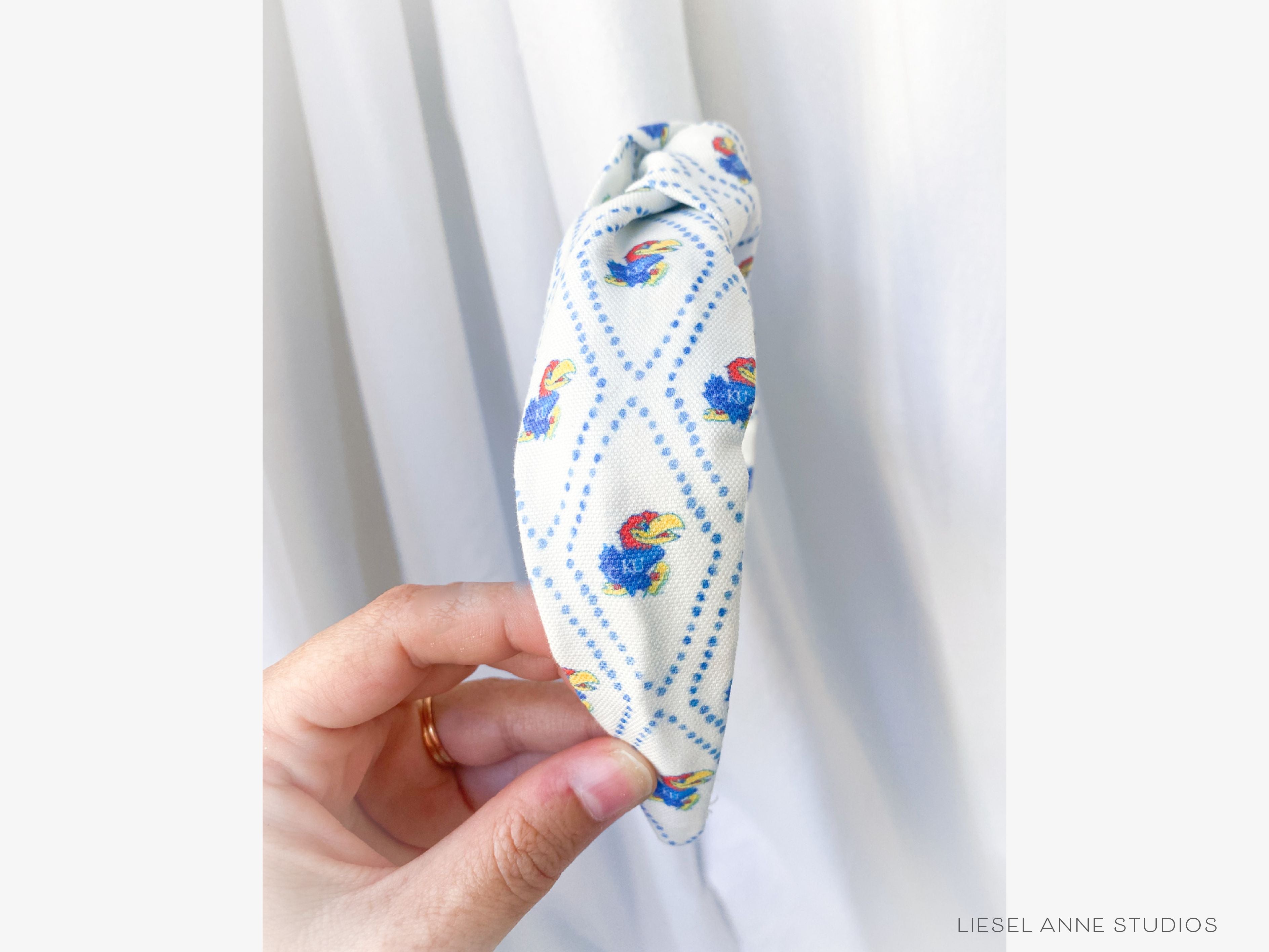Jayhawk Officially Licensed Blue and White Dotted Diamond Headband-These fabric headbands make unique one-of-a-kind gifts as each one is slightly different. They are cut from our hand-painted signature print. These are the perfect accessory and make great gifts!-The Singing Little Bird