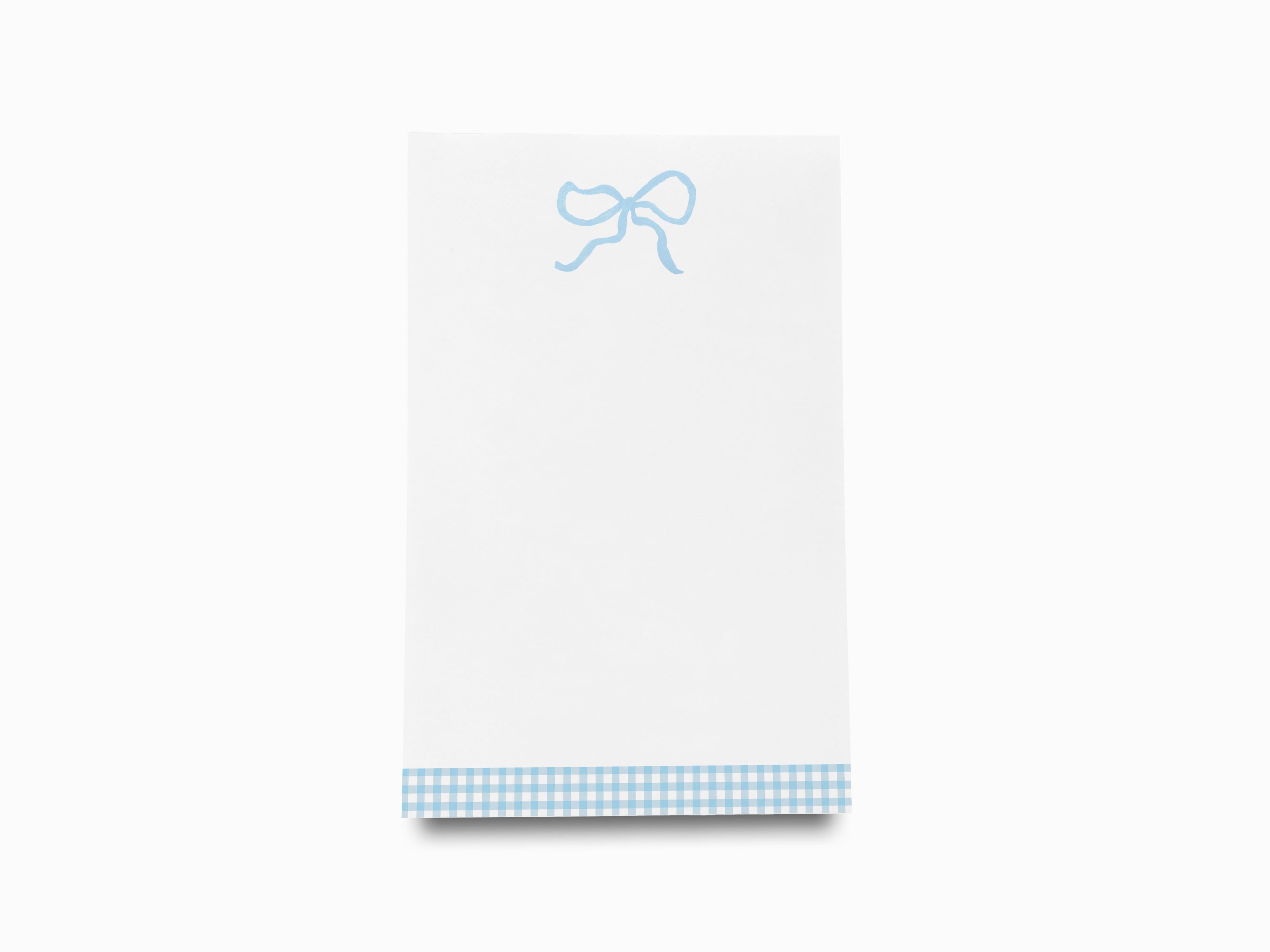 Light Blue Bow Notepad-These notepads feature our hand-painted watercolor bow, printed in the USA on a beautiful smooth stock. You choose which size you want (or bundled together for a beautiful gift set) and makes a great gift for the checklist and feminine bow lover in your life.-The Singing Little Bird