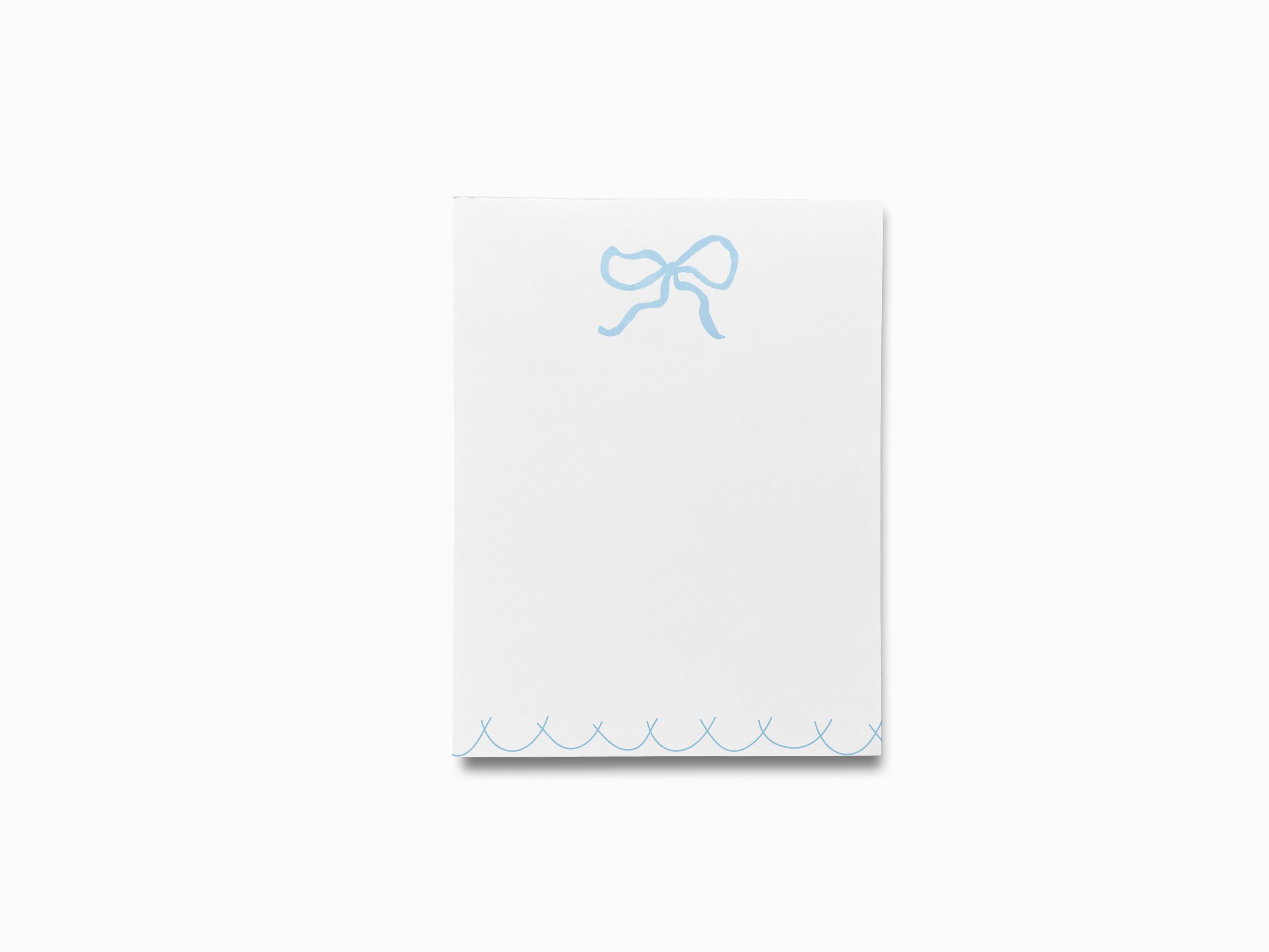 Light Blue Bow Notepad-These notepads feature our hand-painted watercolor bow, printed in the USA on a beautiful smooth stock. You choose which size you want (or bundled together for a beautiful gift set) and makes a great gift for the checklist and feminine bow lover in your life.-The Singing Little Bird