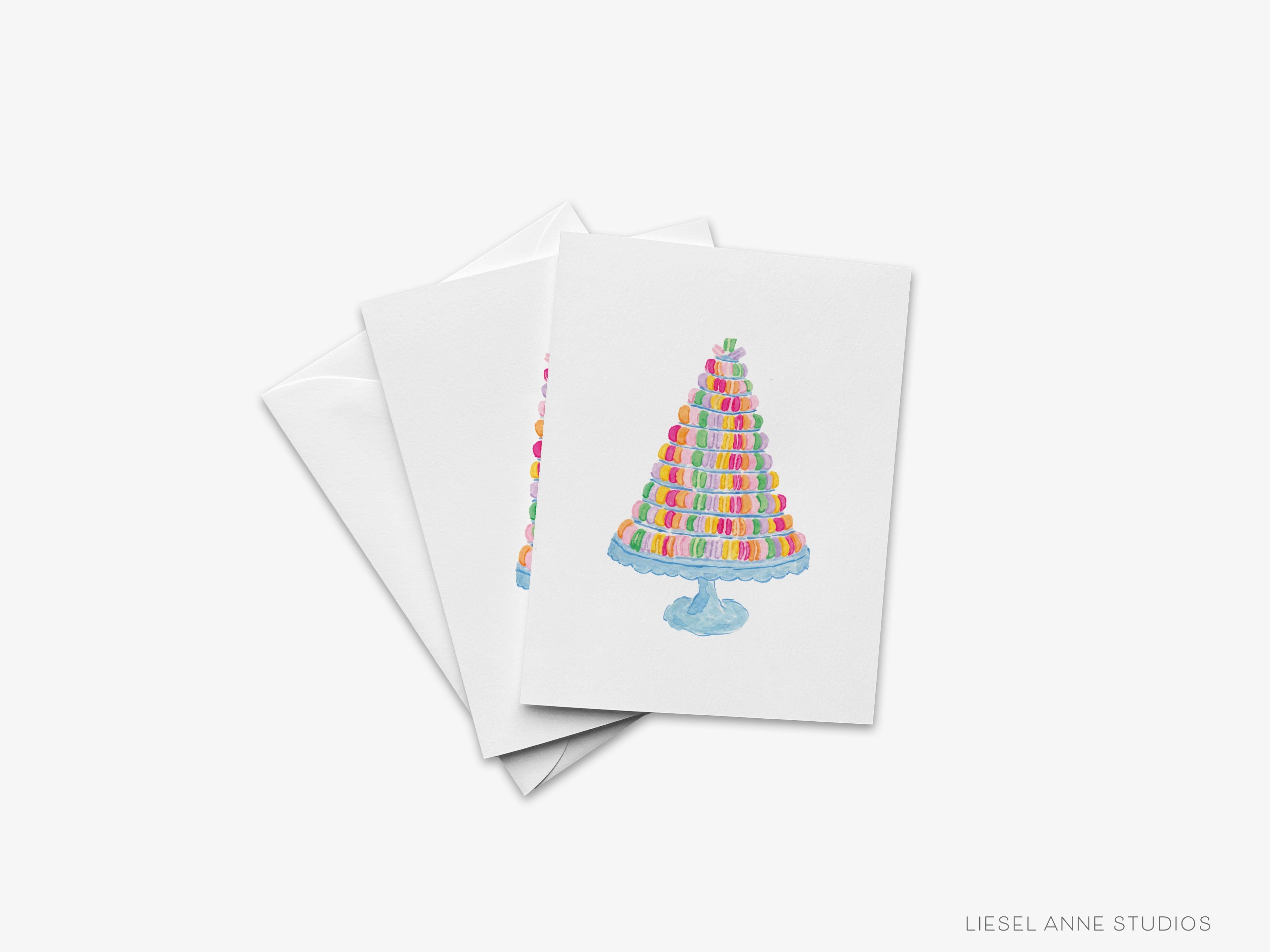 Macaron Tower Greeting Card-These folded cheers cards are 4.25x5.5 and feature our hand-painted watercolor macarons, printed in the USA on 100lb textured stock. They come with a white envelope and make a thoughtful birthday card for a family member or friend.-The Singing Little Bird