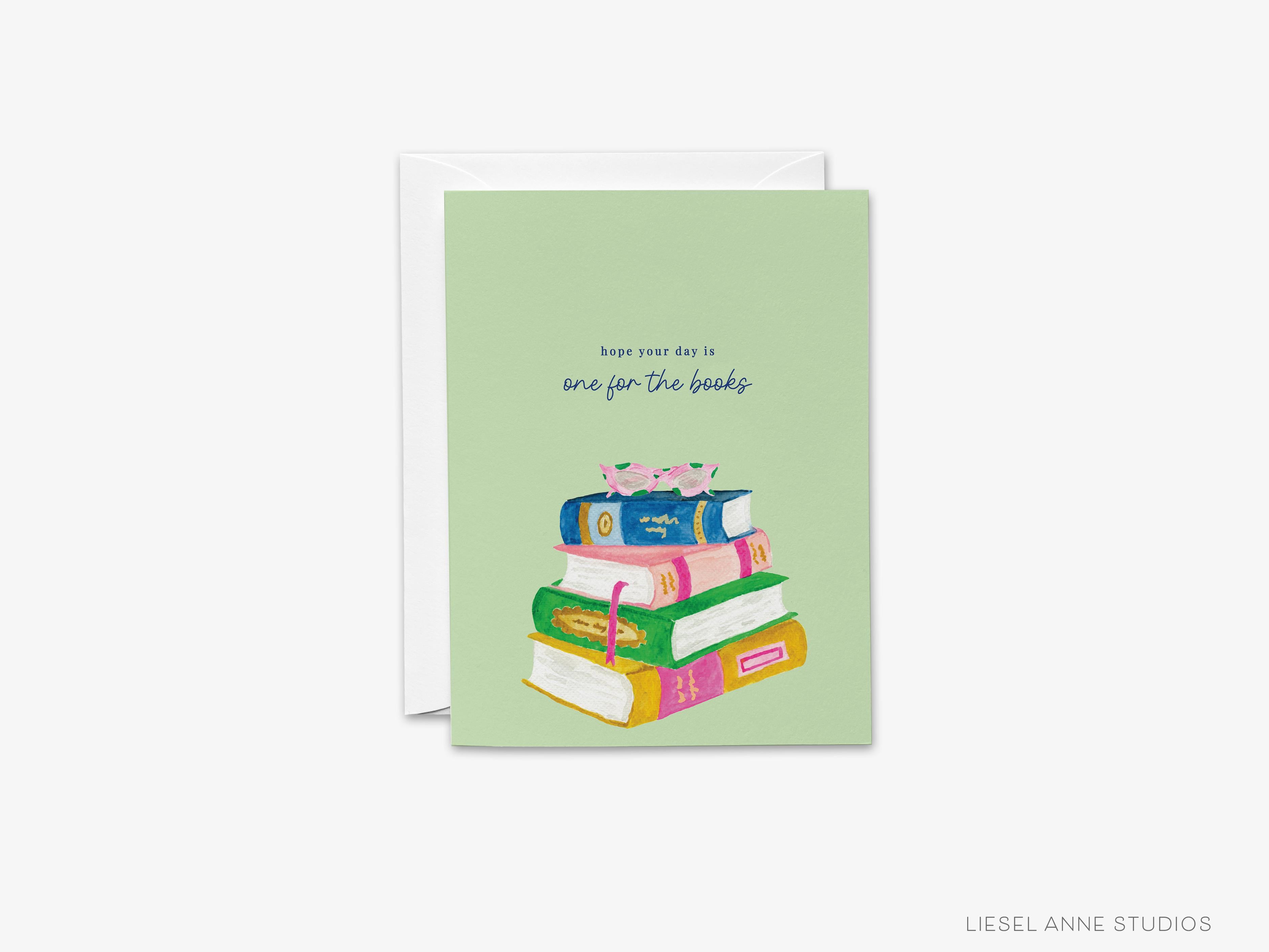 One For The Books Greeting Card-These folded cheers cards are 4.25x5.5 and feature our hand-painted watercolor bookstack, printed in the USA on 100lb textured stock. They come with a white envelope and make a thoughtful birthday card for a family member or friend.-The Singing Little Bird