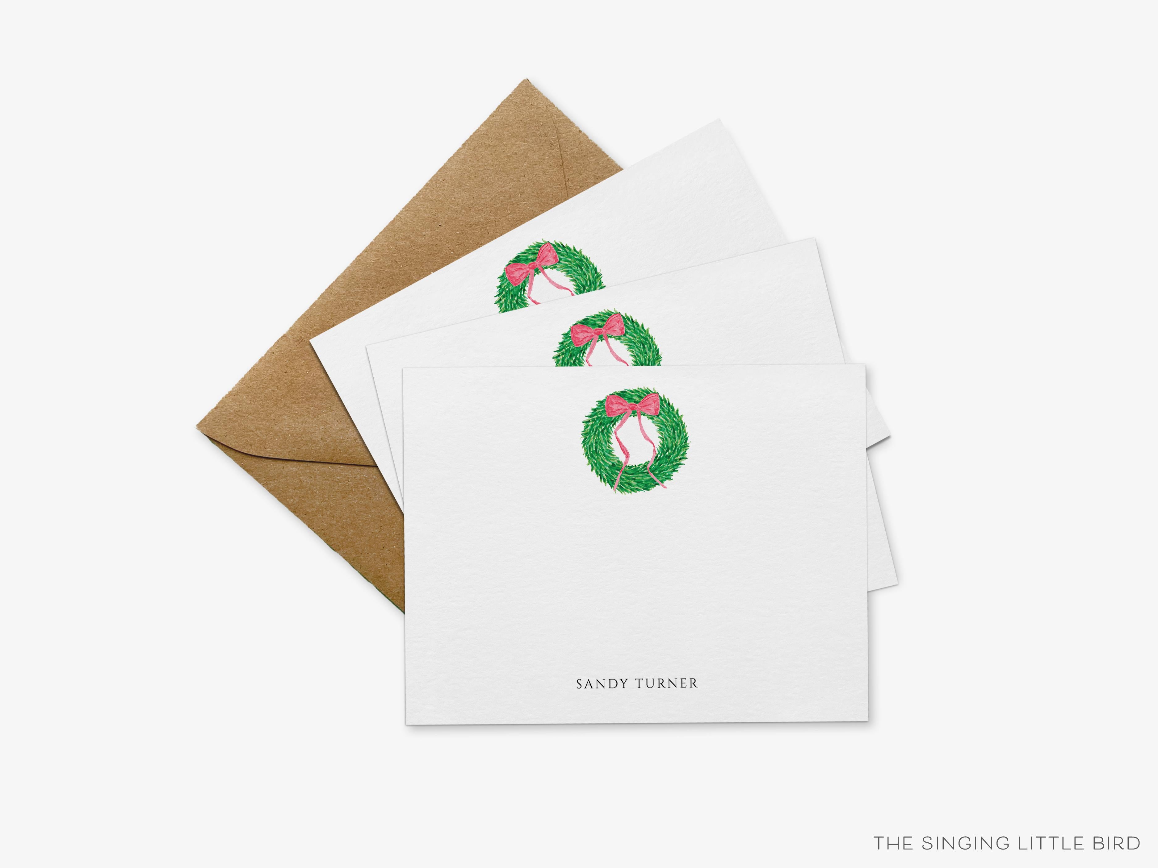 Personalized Christmas Wreath Flat Notes-These personalized flat notecards are 4.25x5.5 and feature our hand-painted watercolor wreath with a red bow, printed in the USA on 120lb textured stock. They come with your choice of envelopes and make great thank yous and gifts for the holiday lover in your life.-The Singing Little Bird