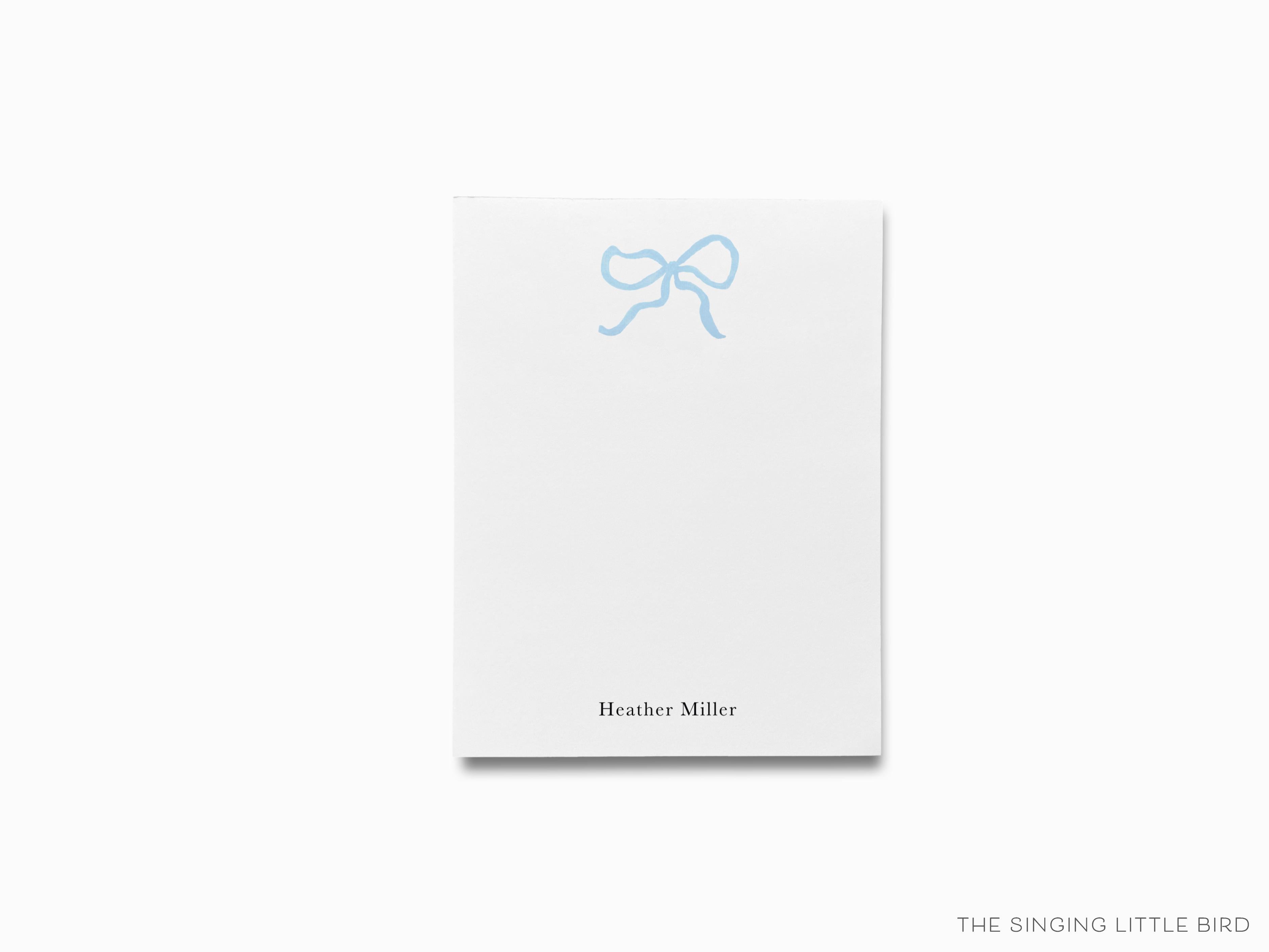 Personalized Light Blue Bow Notepad-These personalized notepads feature our hand-painted watercolor bow, printed in the USA on a beautiful smooth stock. You choose which size you want (or bundled together for a beautiful gift set) and makes a great gift for the checklist and feminine bow lover in your life.-The Singing Little Bird