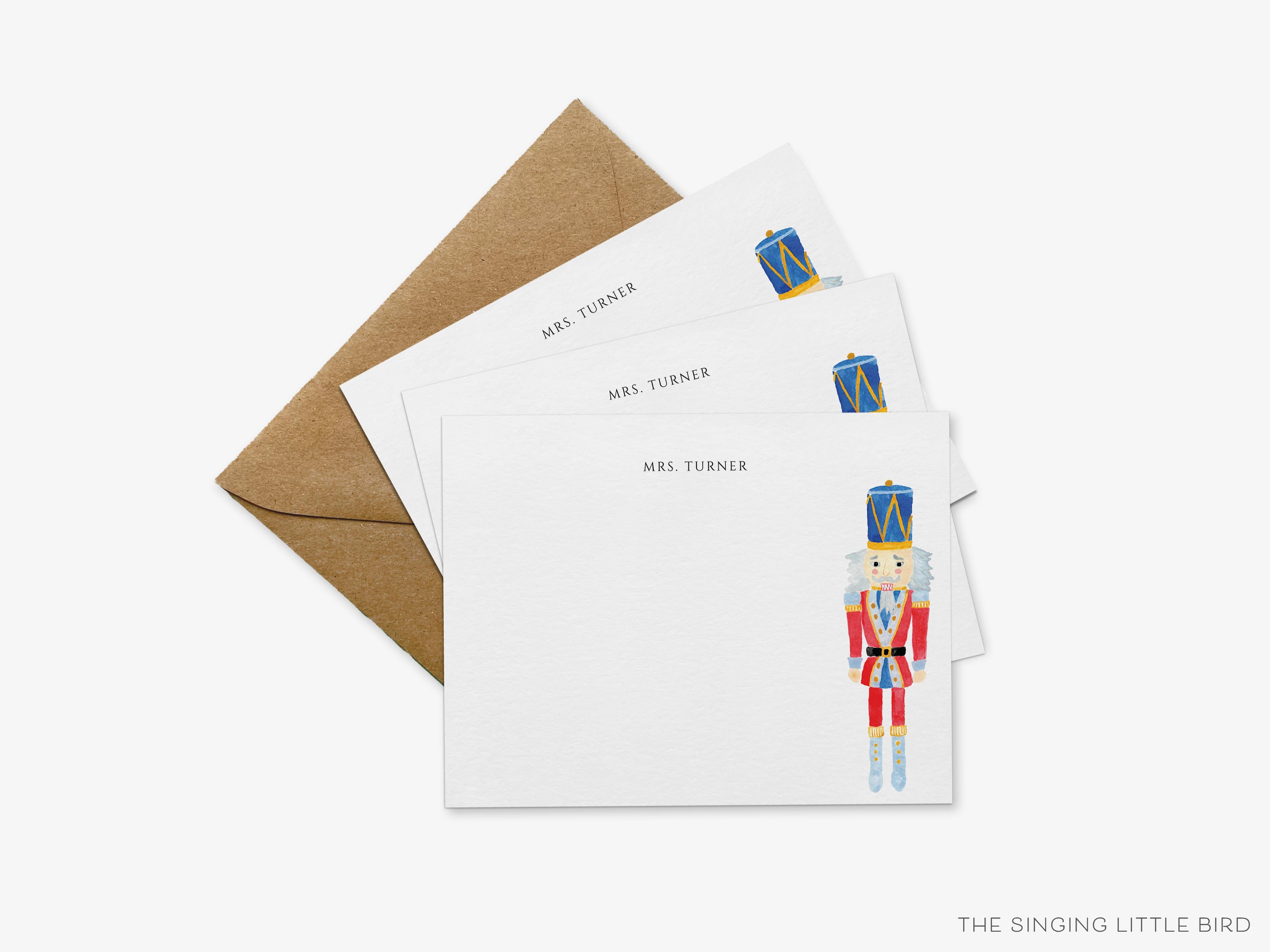 Personalized Nutcracker Holiday Flat Notes-These personalized flat notecards are 4.25x5.5 and feature our hand-painted watercolor nutcracker, printed in the USA on 120lb textured stock. They come with your choice of envelopes and make great thank yous and gifts for the holiday lover in your life.-The Singing Little Bird