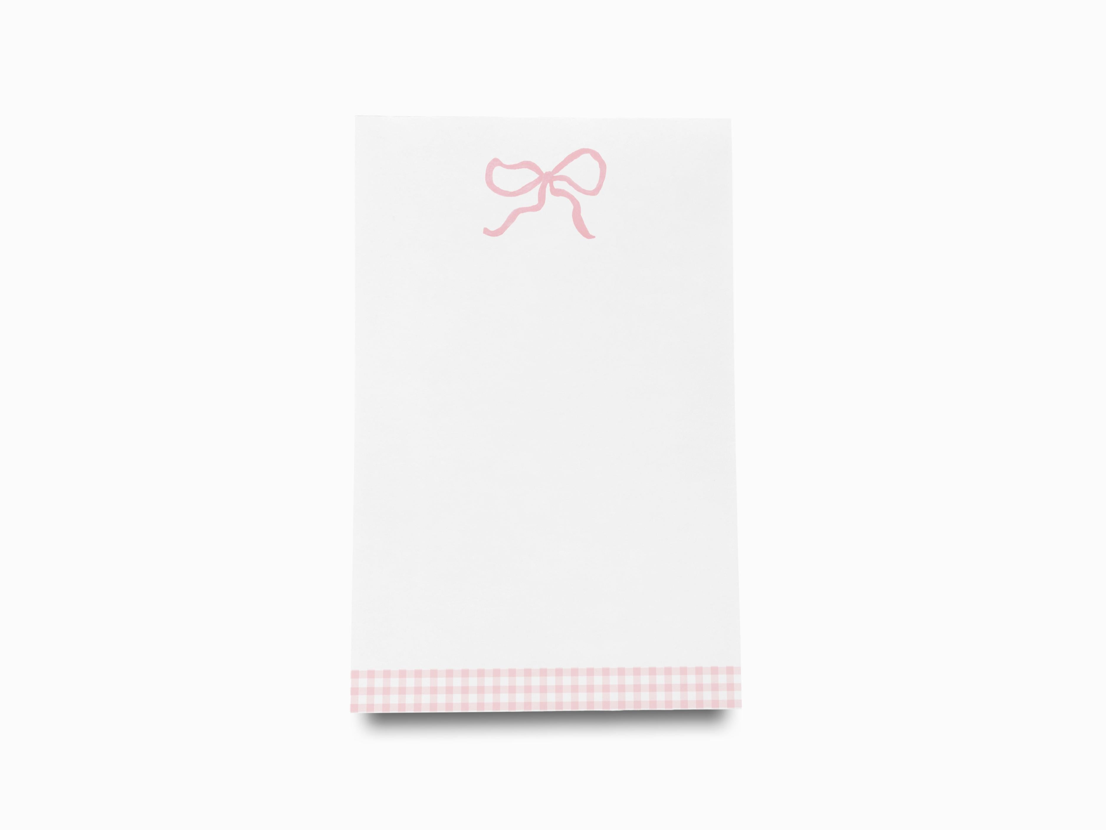 Pink Bow Notepad-These notepads feature our hand-painted watercolor bow, printed in the USA on a beautiful smooth stock. You choose which size you want (or bundled together for a beautiful gift set) and makes a great gift for the checklist and feminine bow lover in your life.-The Singing Little Bird