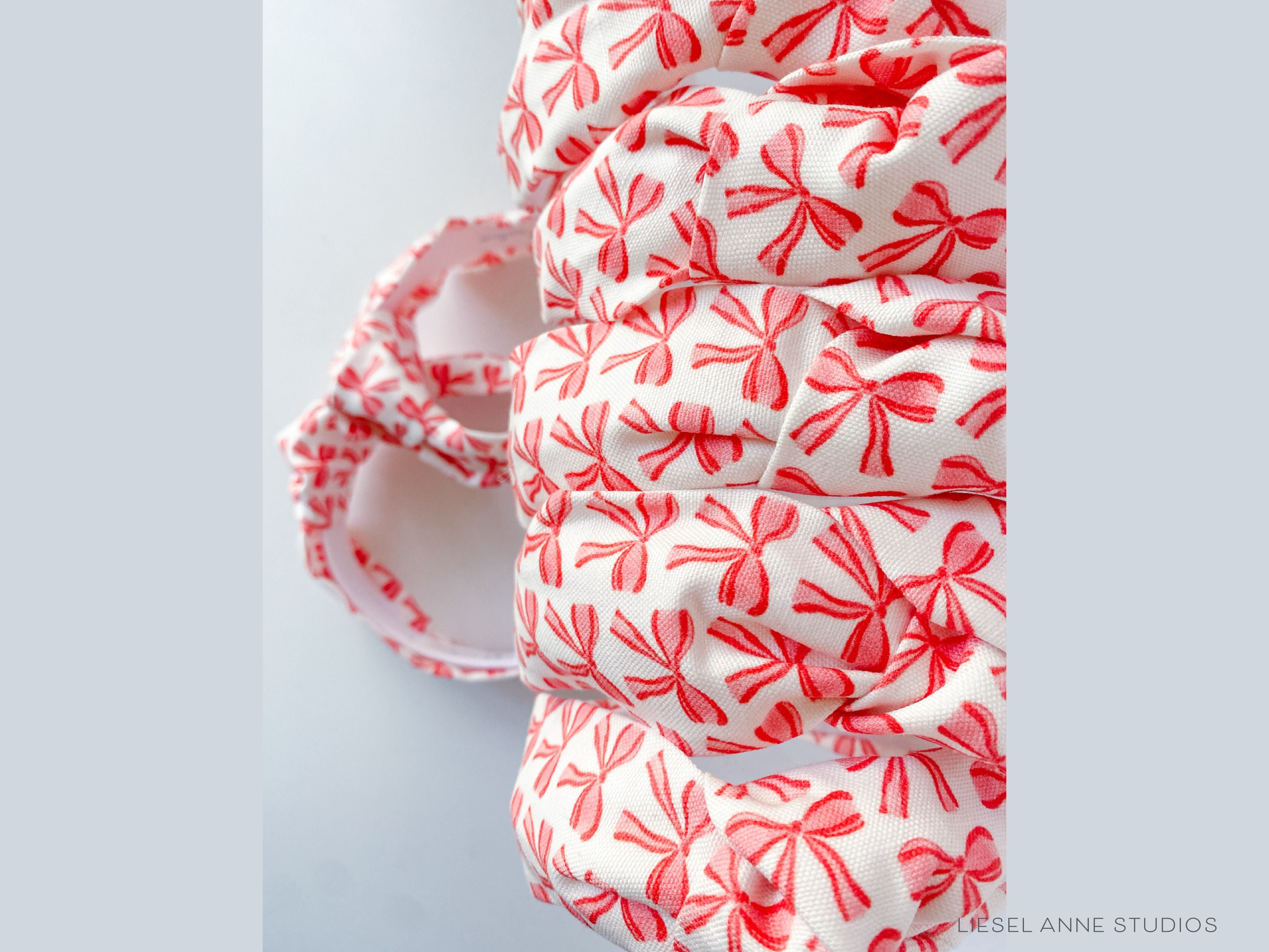 Red Bow Top Knot Headband-These fabric headbands make unique one-of-a-kind gifts as each one is slightly different. They are cut from our hand-painted signature print. These are the perfect accessory and make great gifts!-The Singing Little Bird