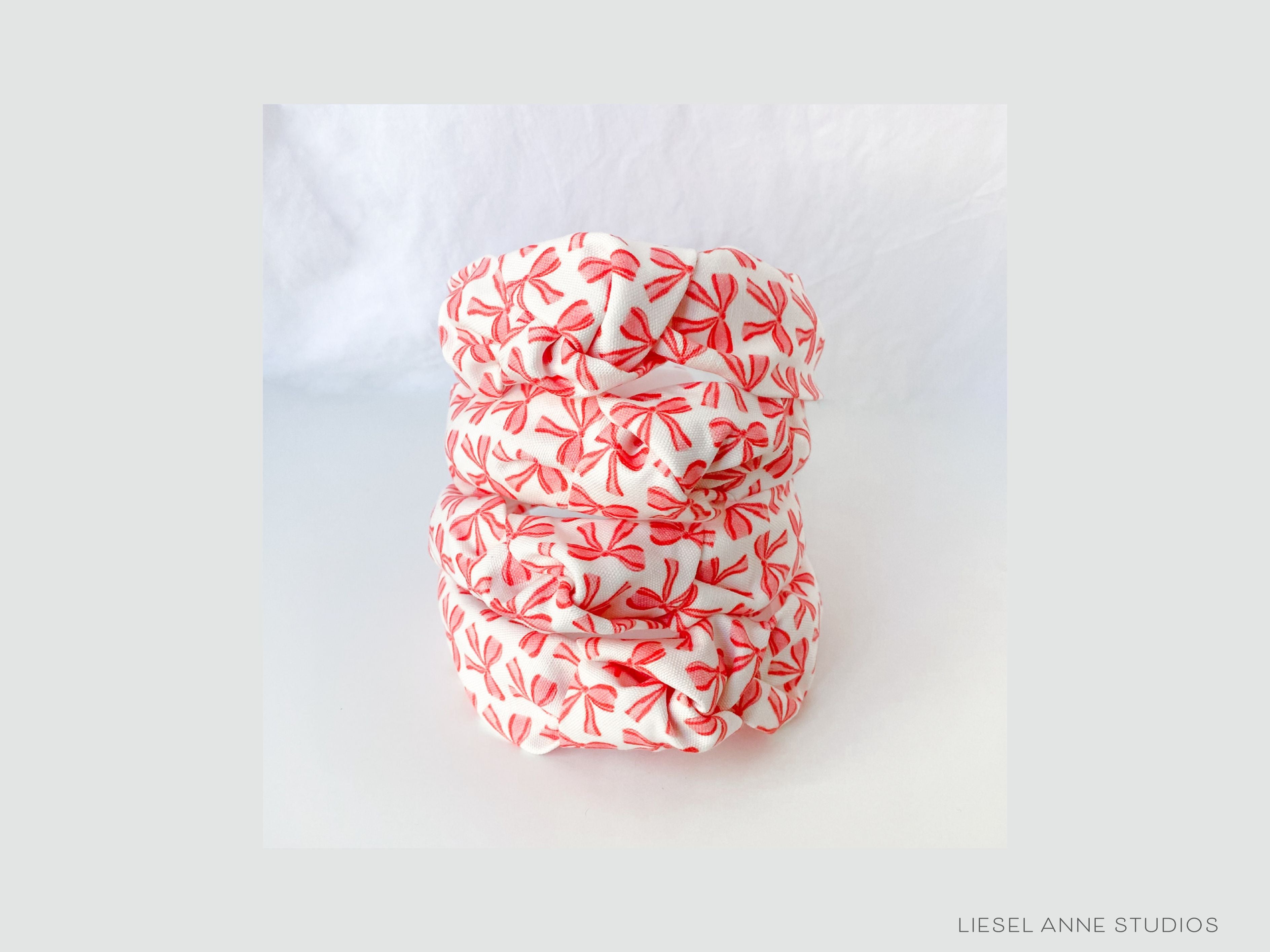 Red Bow Top Knot Headband-These fabric headbands make unique one-of-a-kind gifts as each one is slightly different. They are cut from our hand-painted signature print. These are the perfect accessory and make great gifts!-The Singing Little Bird