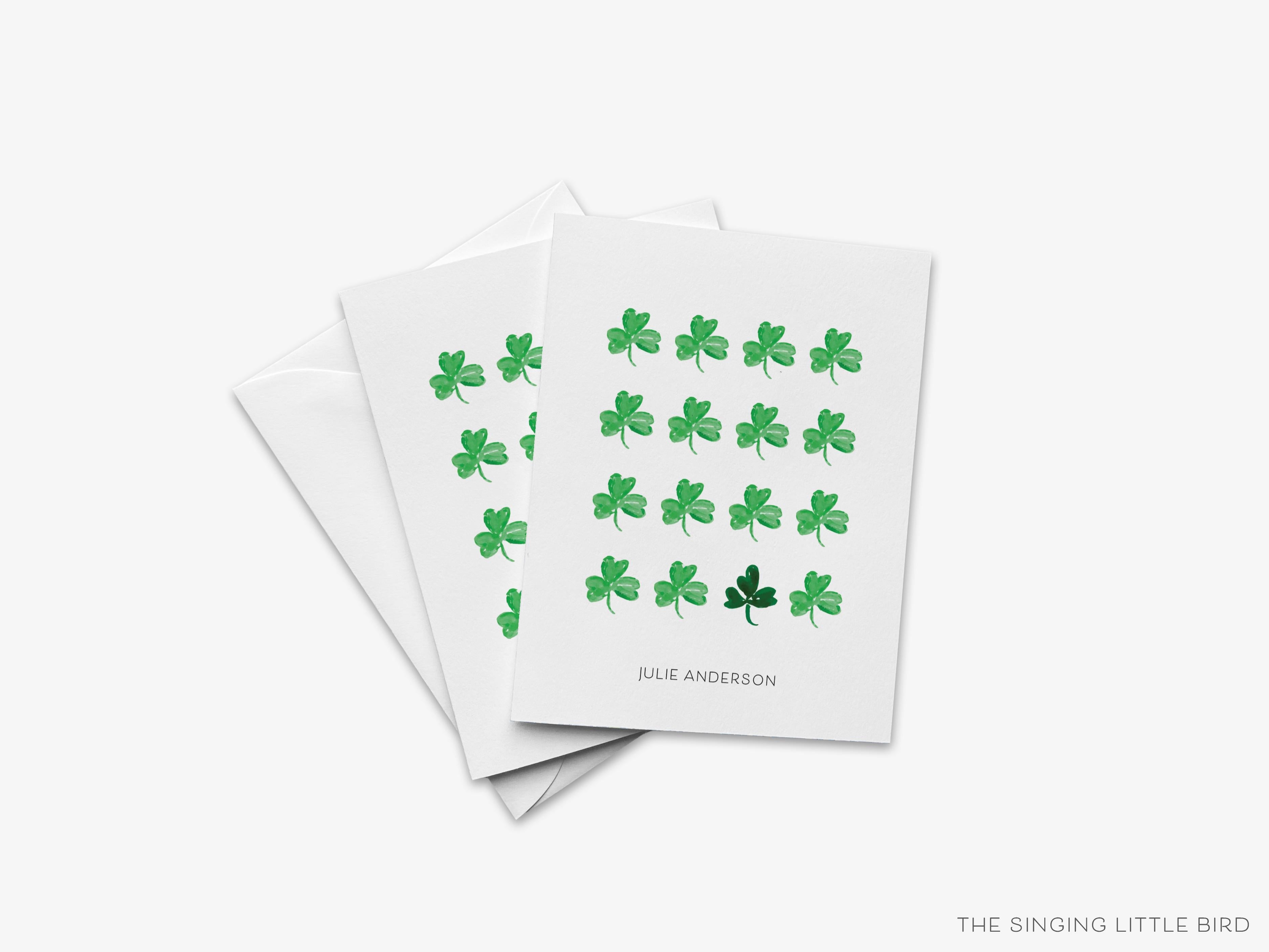 Shamrock Greeting Card-These folded spring cards are 4.25x5.5 and feature our hand-painted watercolor three leaf clovers, printed in the USA on 100lb textured stock. They come with a White envelope and make a lovely card to say thank you or just because to your friends. -The Singing Little Bird