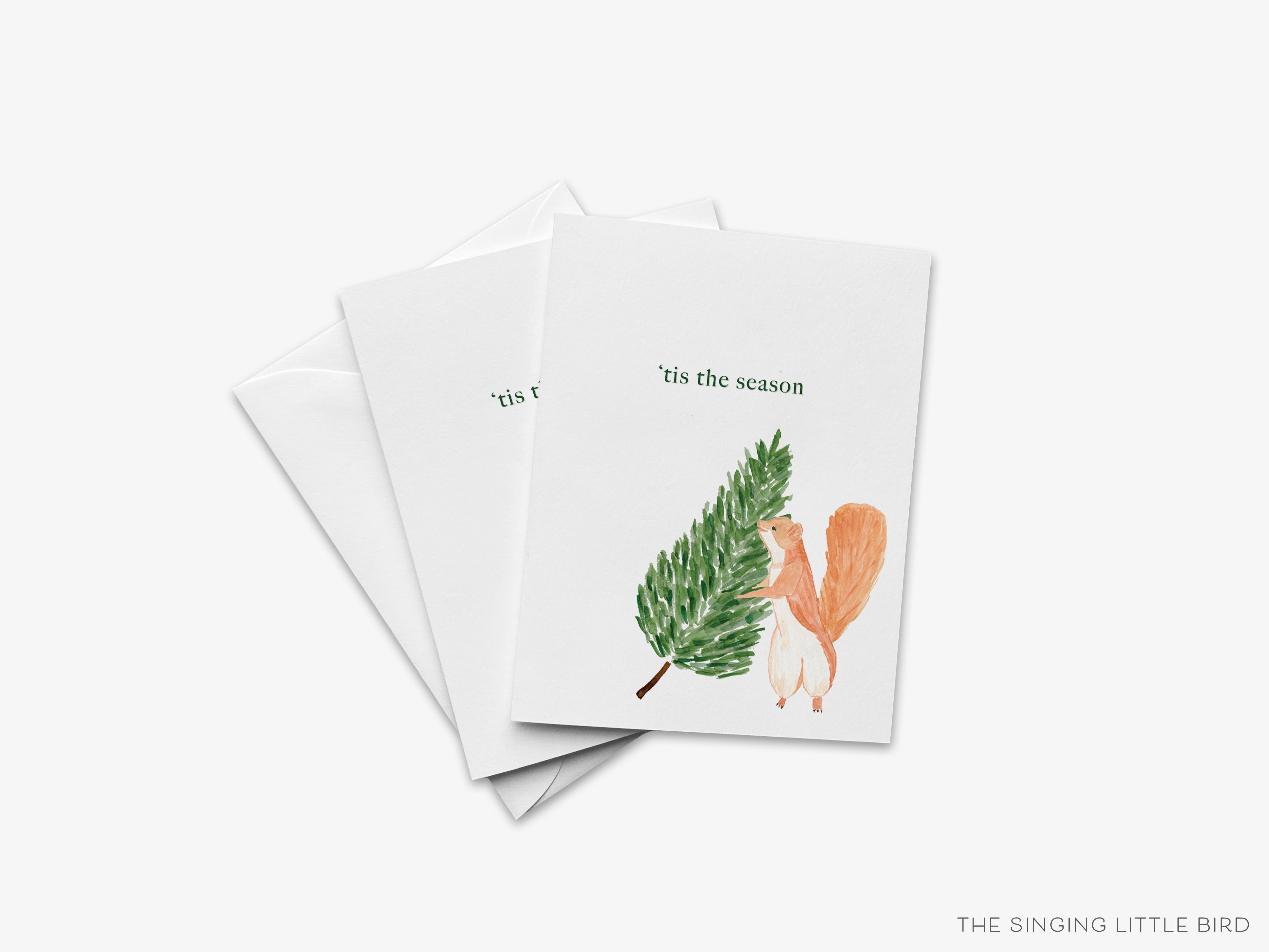 Tis The Season Squirrel Christmas Greeting Card-These folded greeting cards are 4.25x5.5 and feature our hand-painted evergreen tree and squirrel, printed in the USA on 100lb textured stock. They come with a White envelope and make a great Christmas card for the tree and animal lover in your life.-The Singing Little Bird