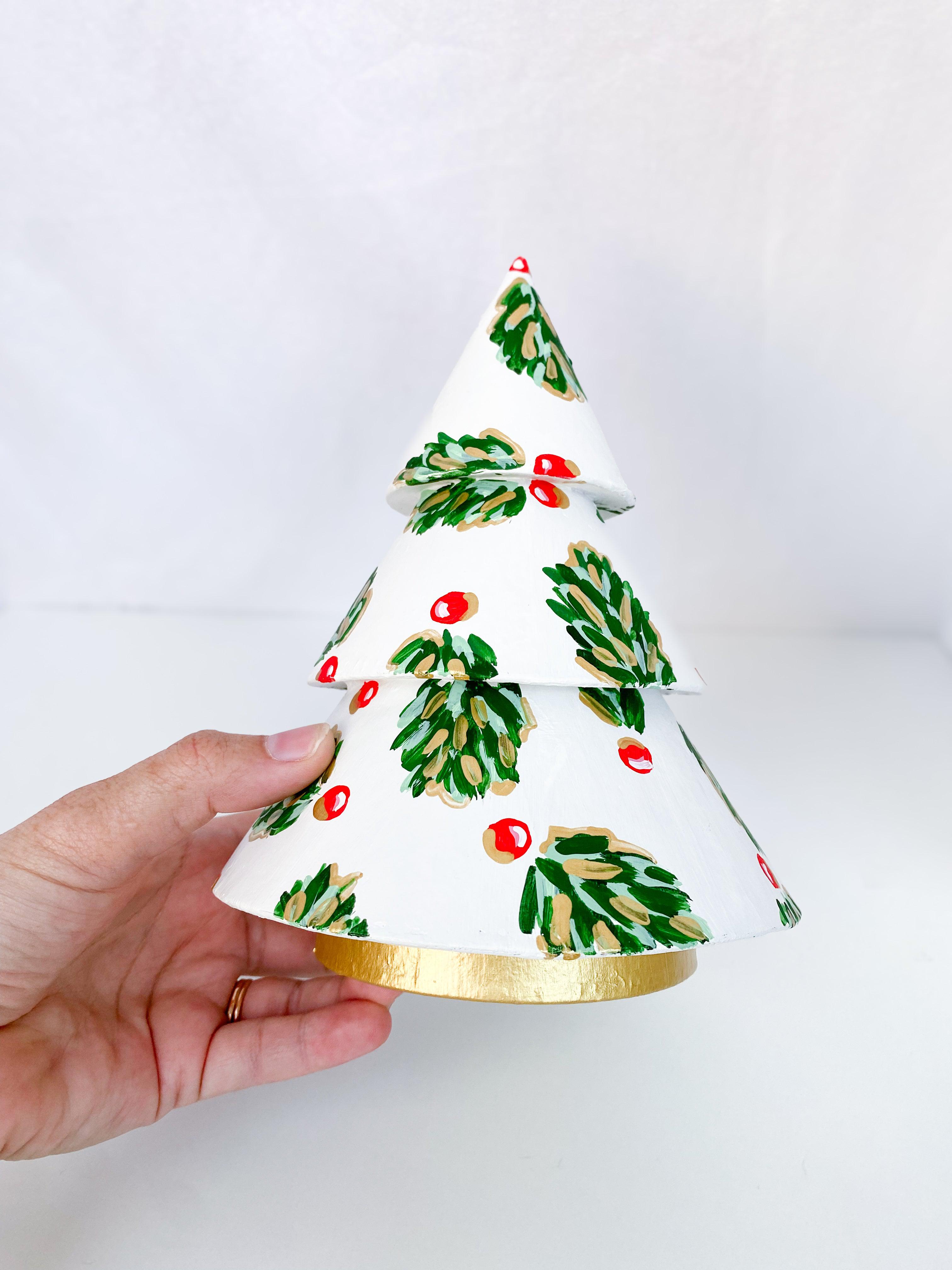 Winter Pearl Golden Holly Mini Tree - Short-Hand-Painted Mini Christmas Tree | Measures 7.5" tall and approx. 5.5" wide | Features the Golden Holly design with an ivory base and shimmery gold accents and gold trunk | Light-weight and non-breakable paper mache tree | Coated with a protective matte finish that will keep it shimmering year after year | Each tree is slightly different with potential small imperfections due to the hand-painted nature, making each one special and unique!-The Singing Little Bird