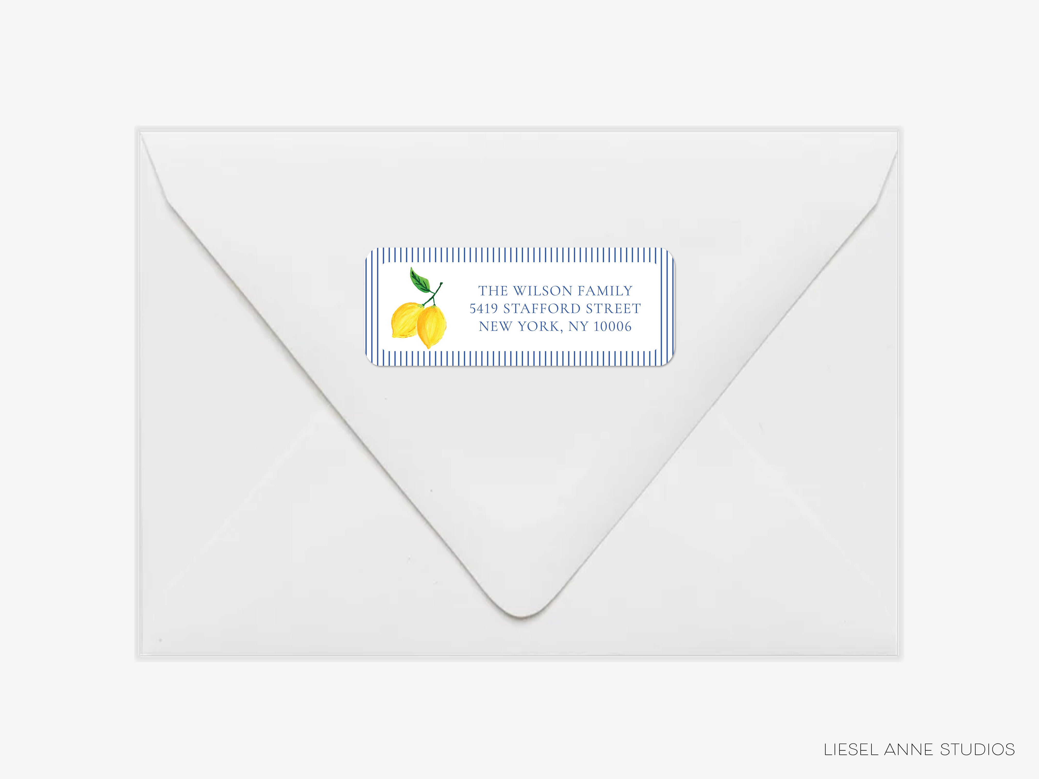 a white envelope with a label on it, featuring a lemon graphic and text.