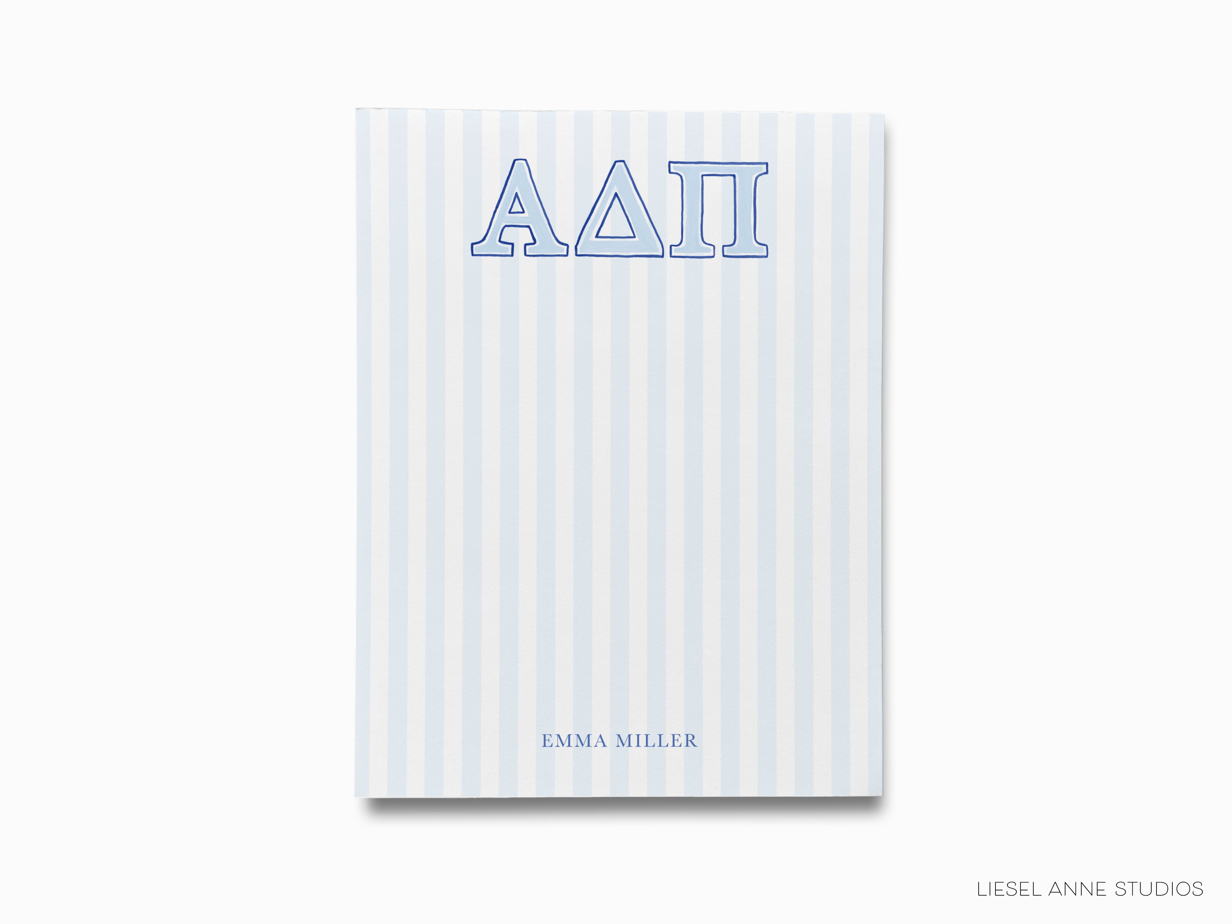 a blue and white striped notebook with the word aati on it