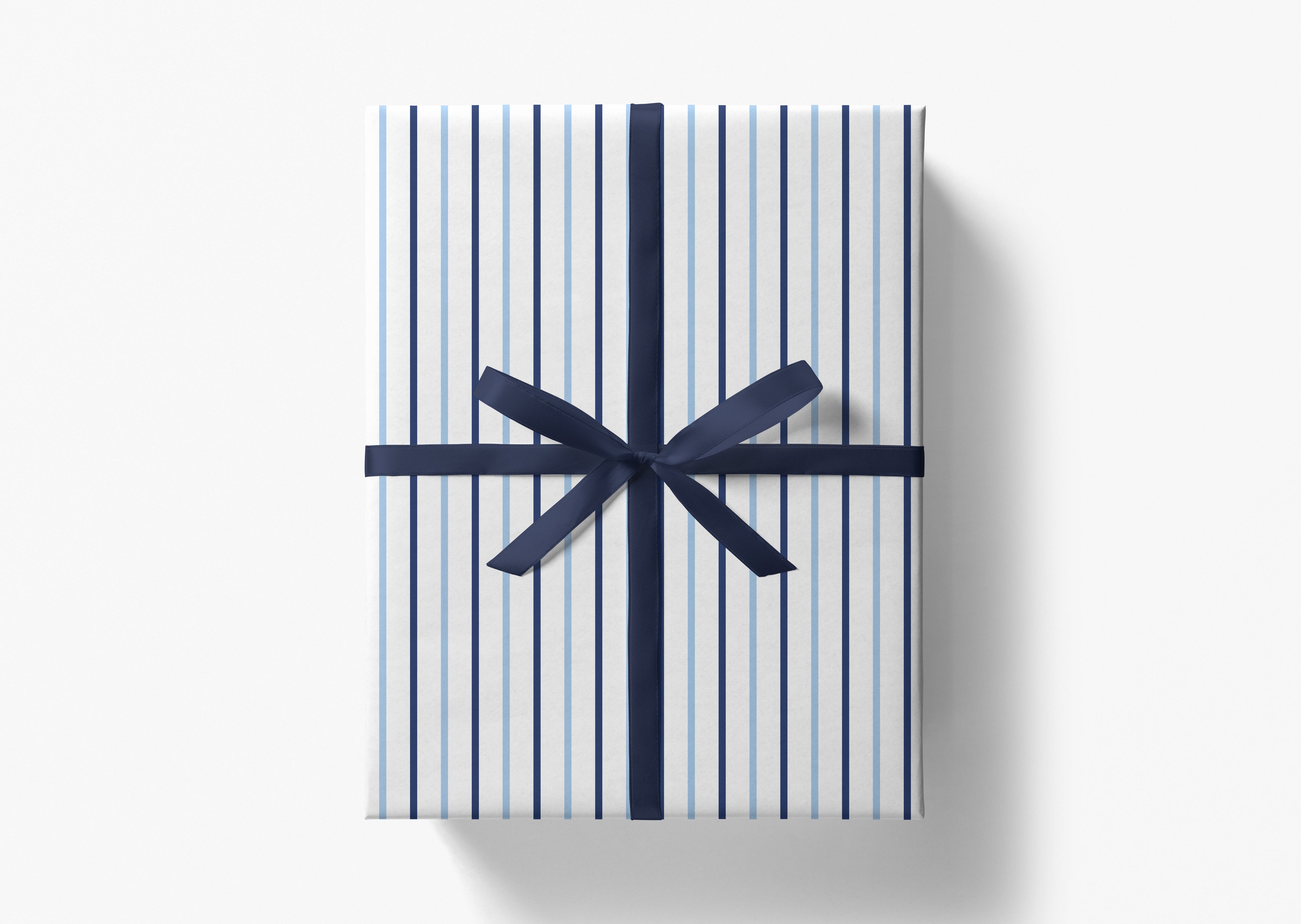 A gift box wrapped in blue and white striped paper with a black ribbon bow tied around it.
