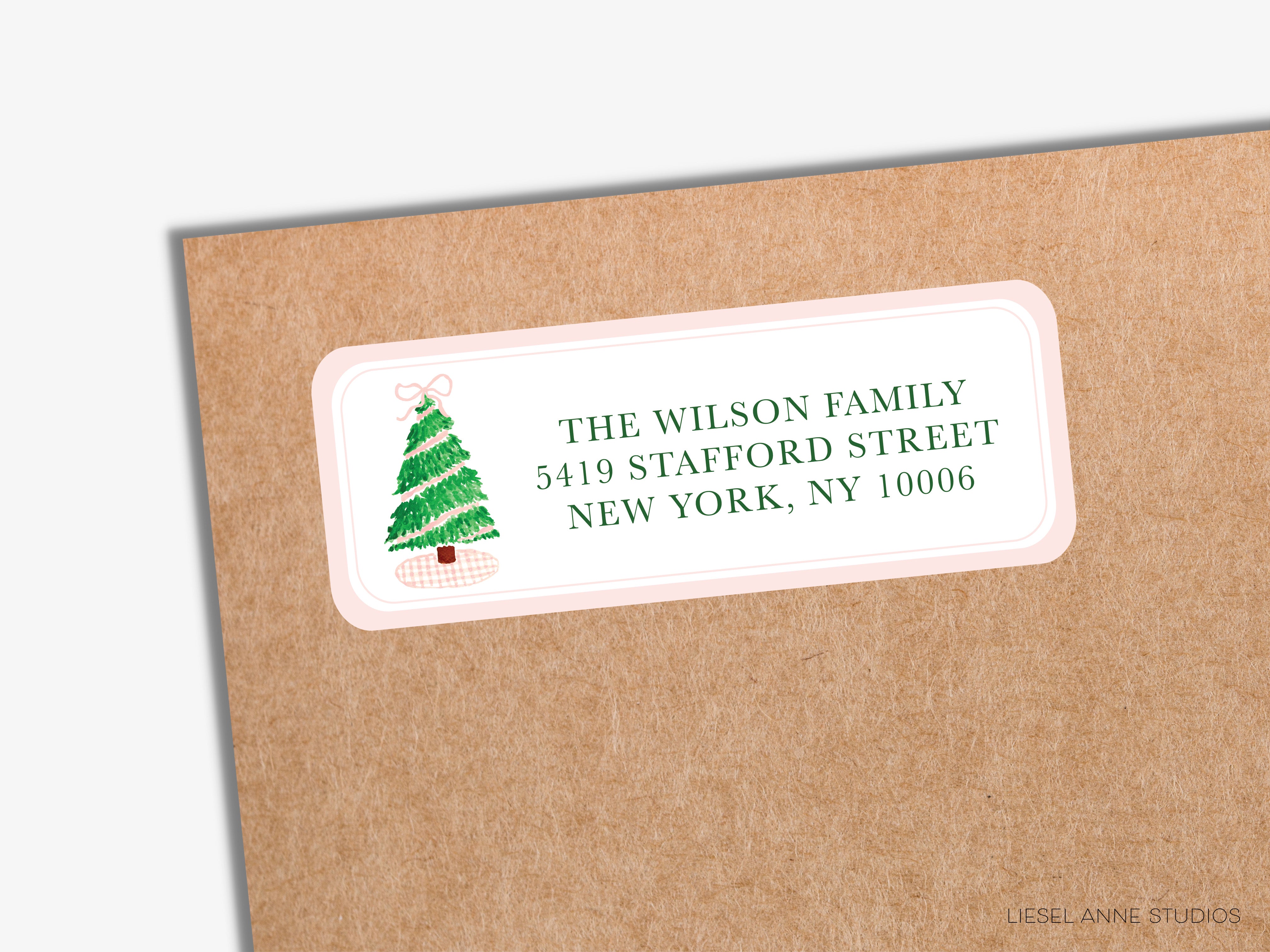 a label with a Christmas tree on it, placed on a brown envelope.