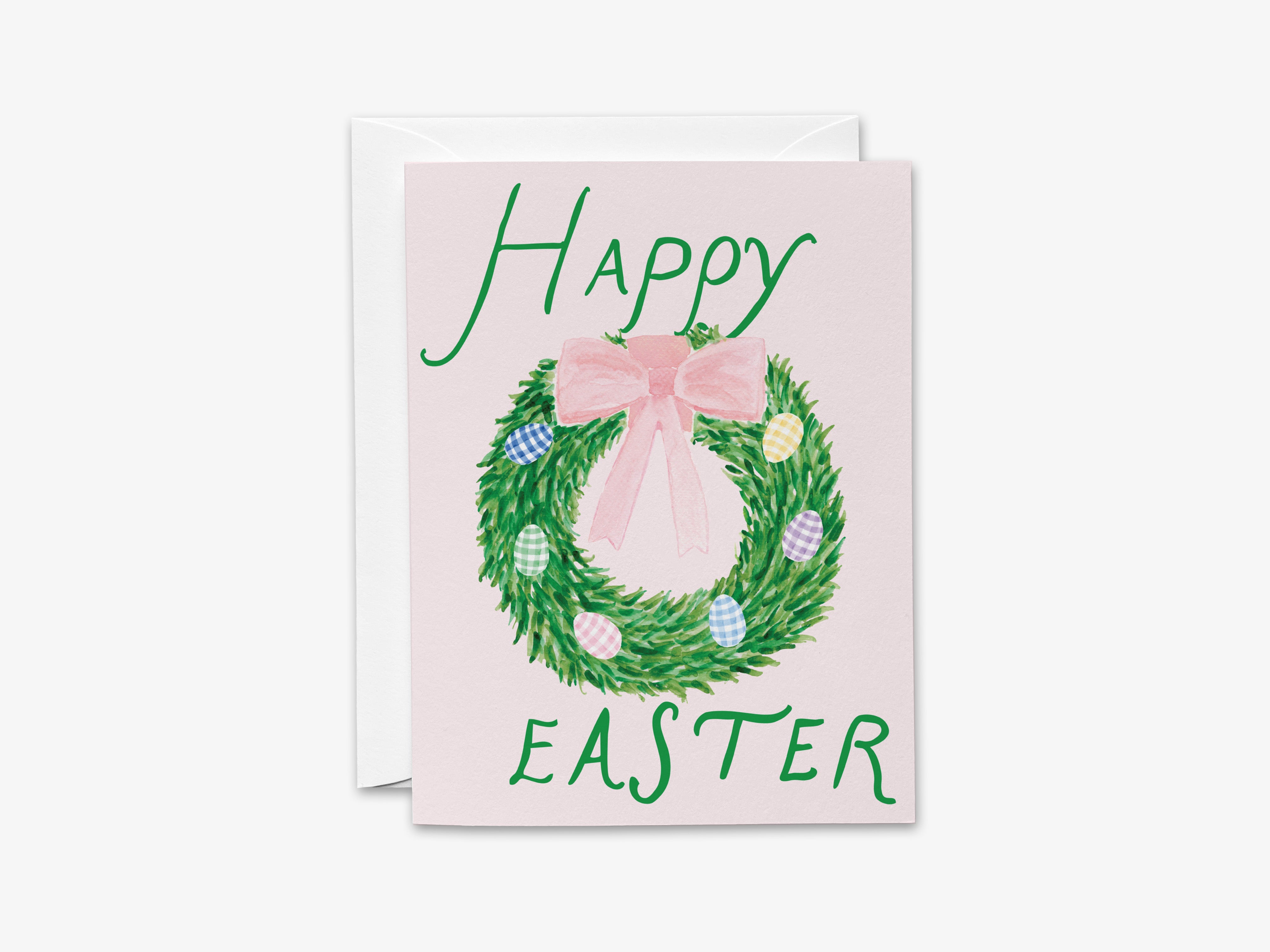 A pink Easter greeting card with a wreath and Easter eggs.