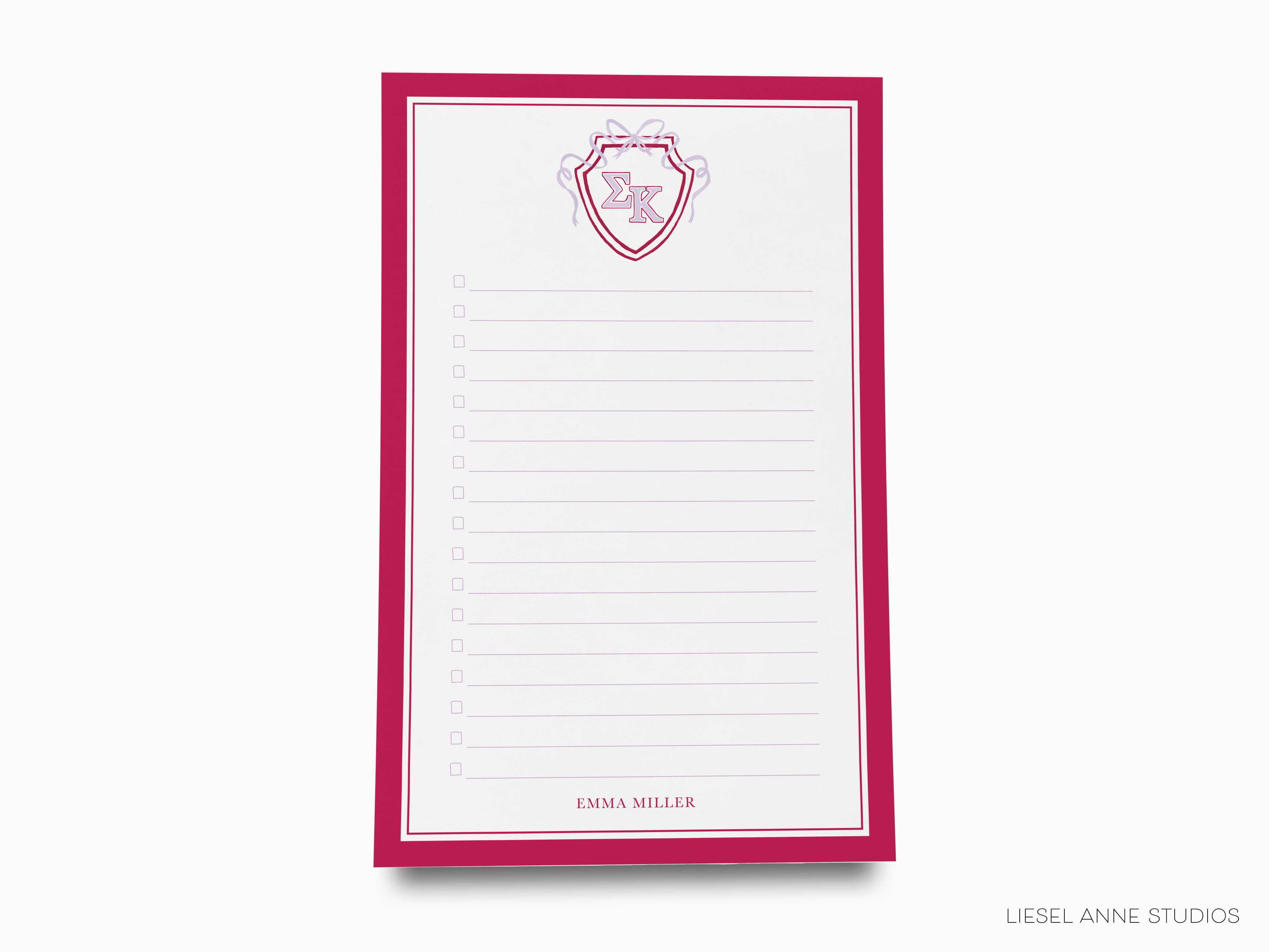 a notepad with a picture of a shield on it
