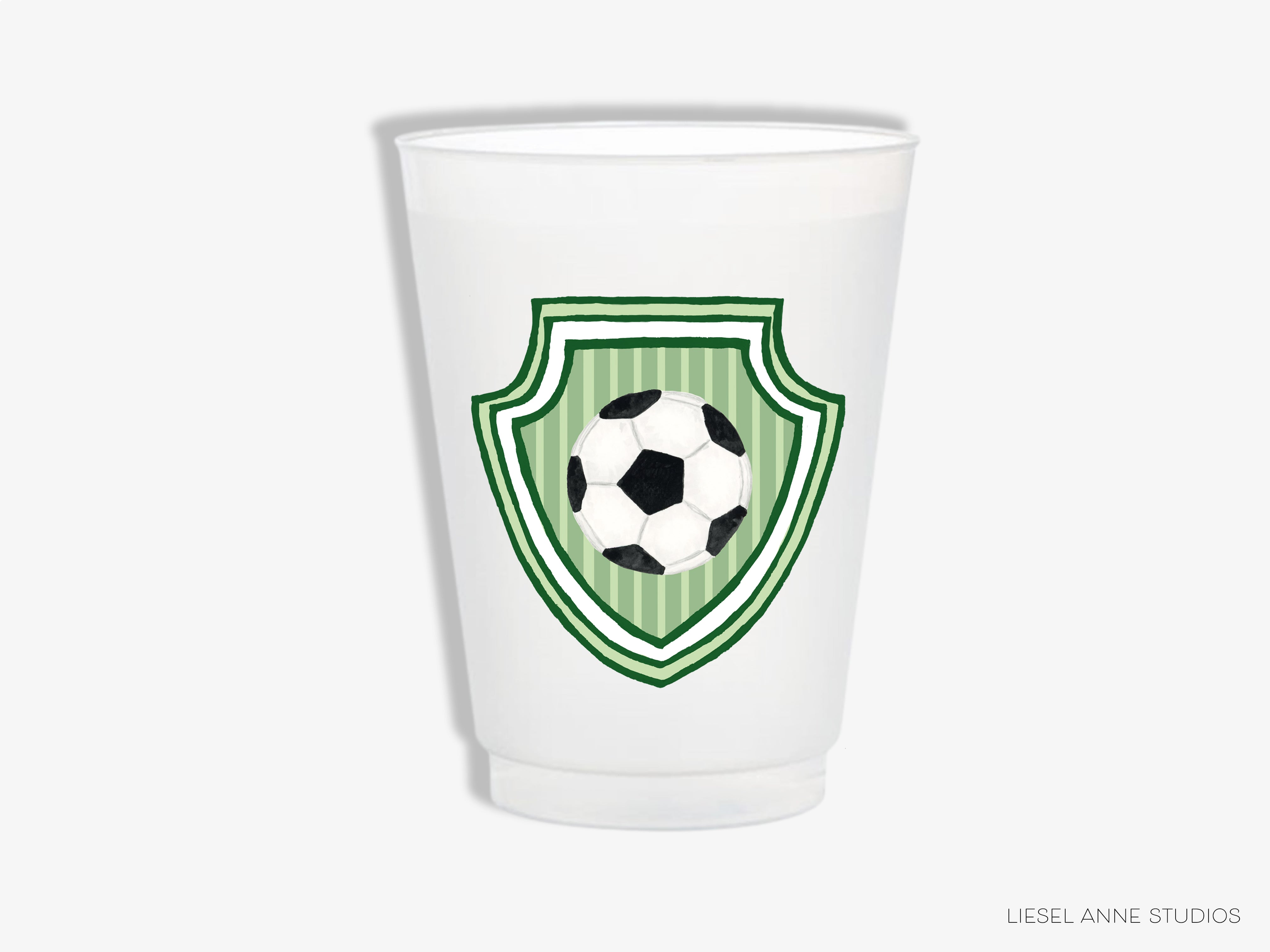 A white plastic cup with a green and white soccer ball design on it.