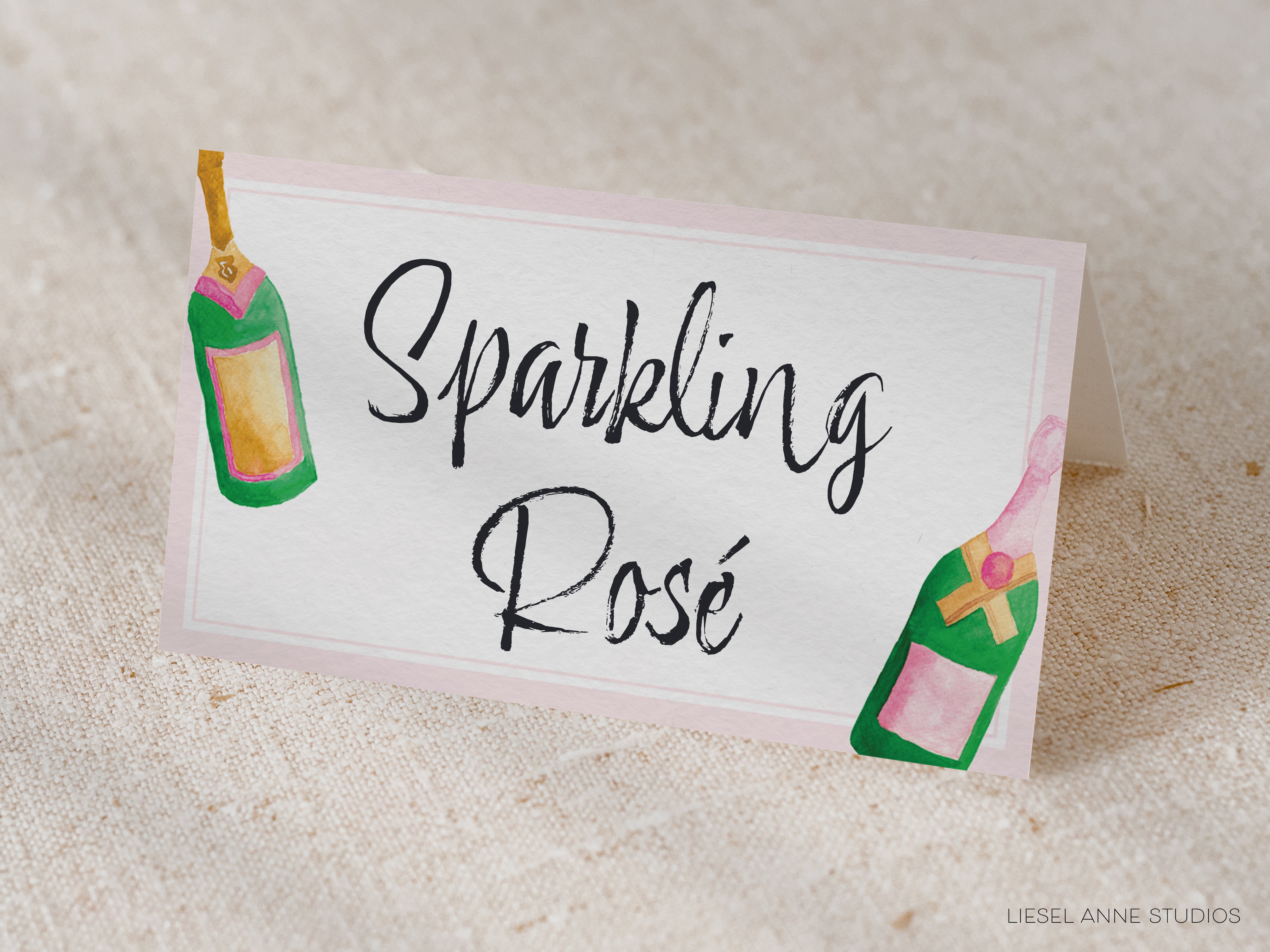 a white card with the text "Sparkling Rose" written on it, along with illustrations of champagne bottles.