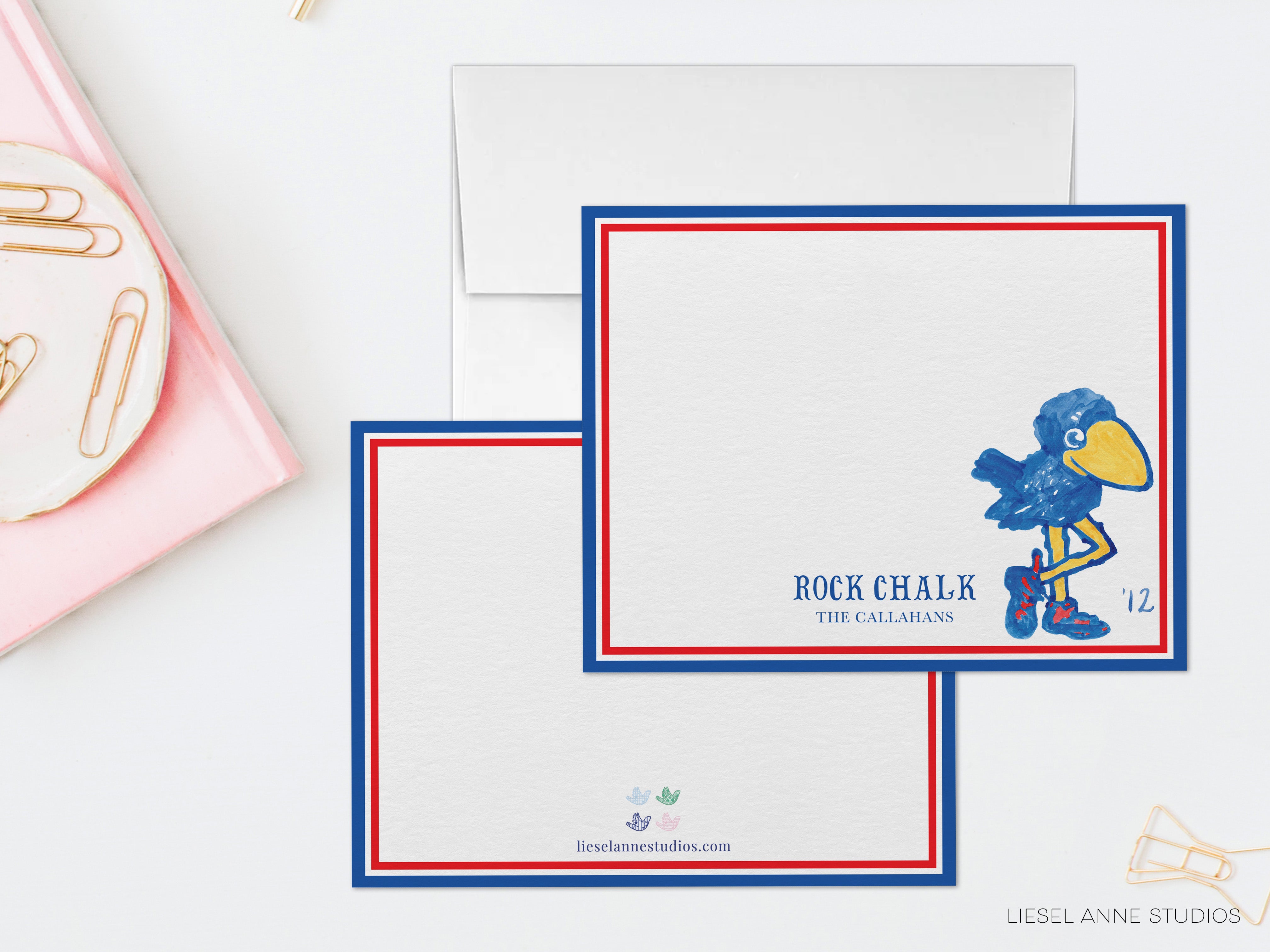 a set of blank cards with a blue bird illustration, placed on a white surface.