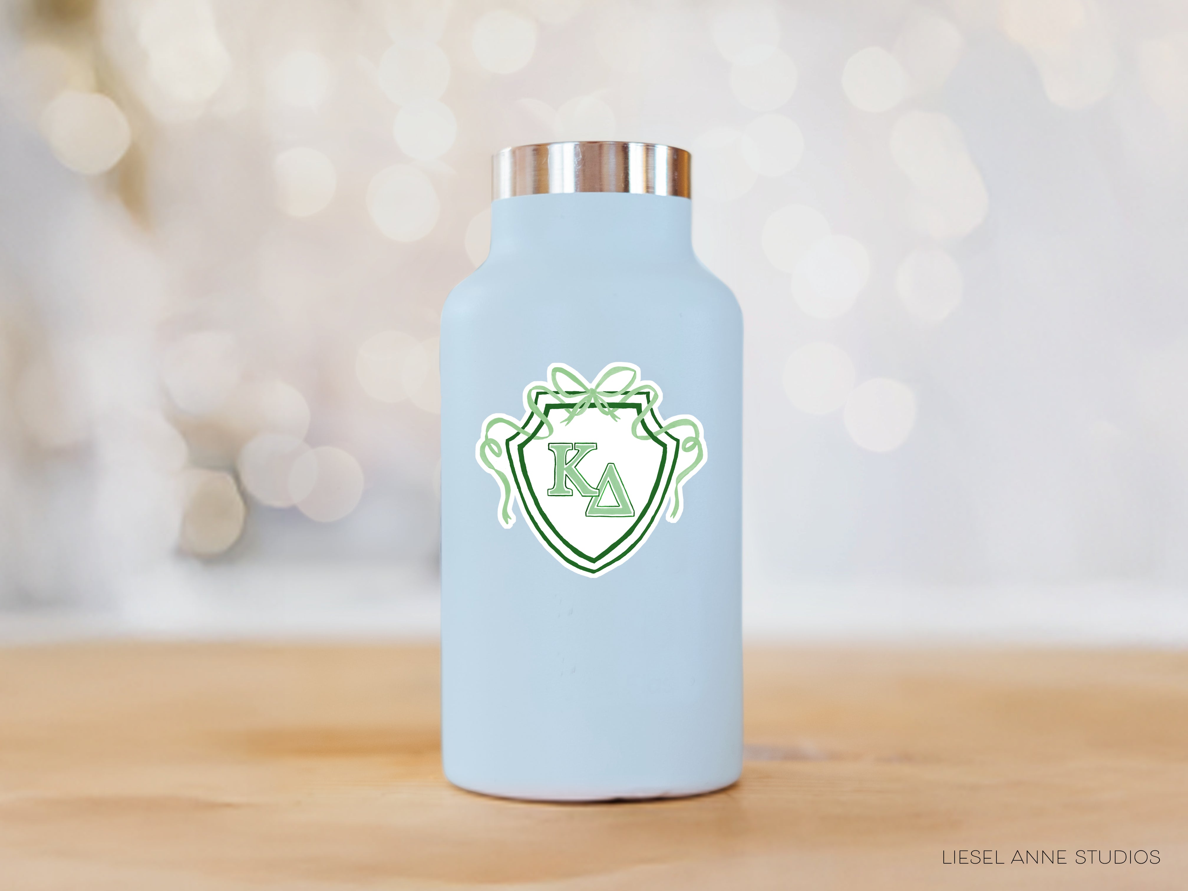 a light blue water bottle with a logo on it