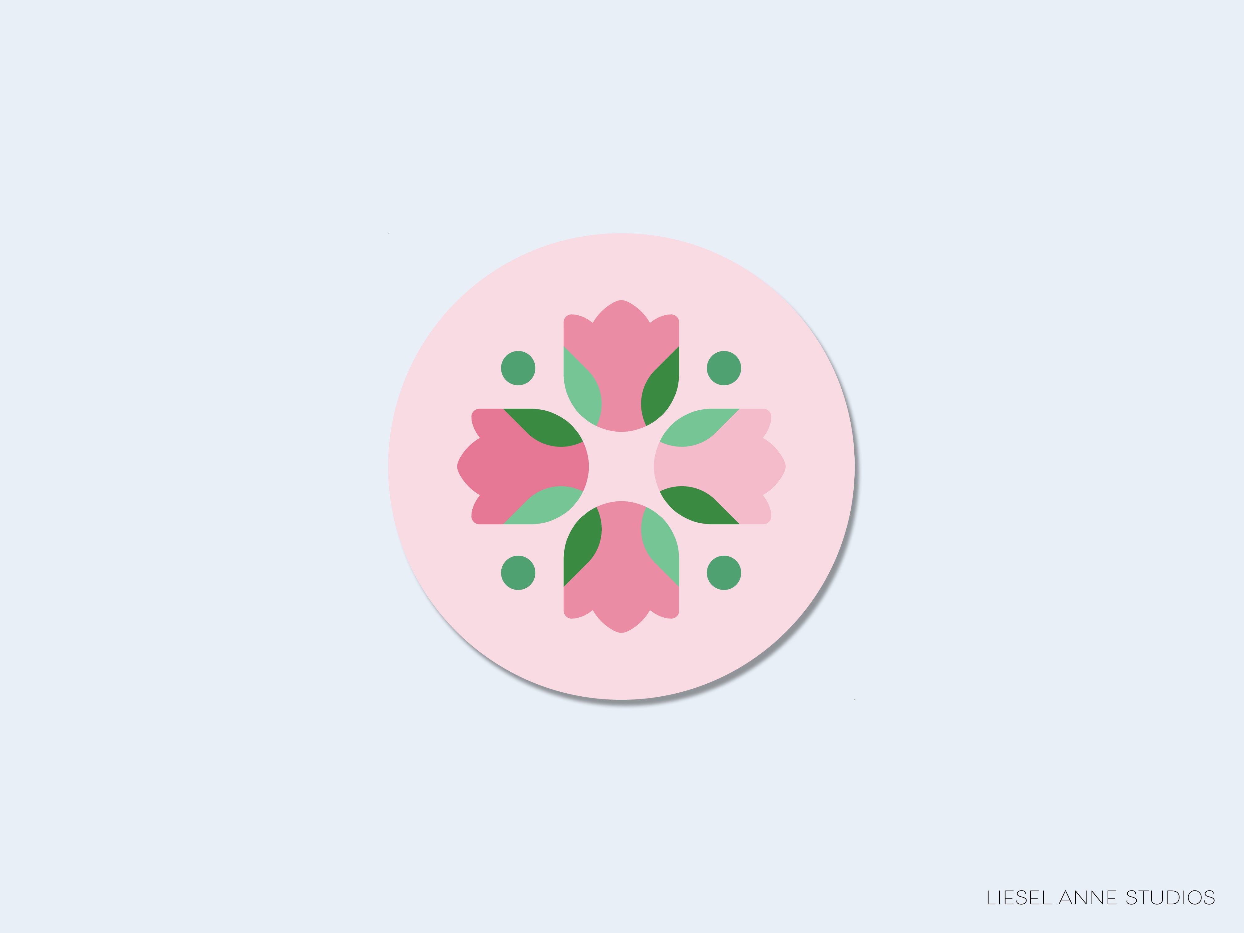 A circular design featuring a pink flower with green leaves and small green circles.