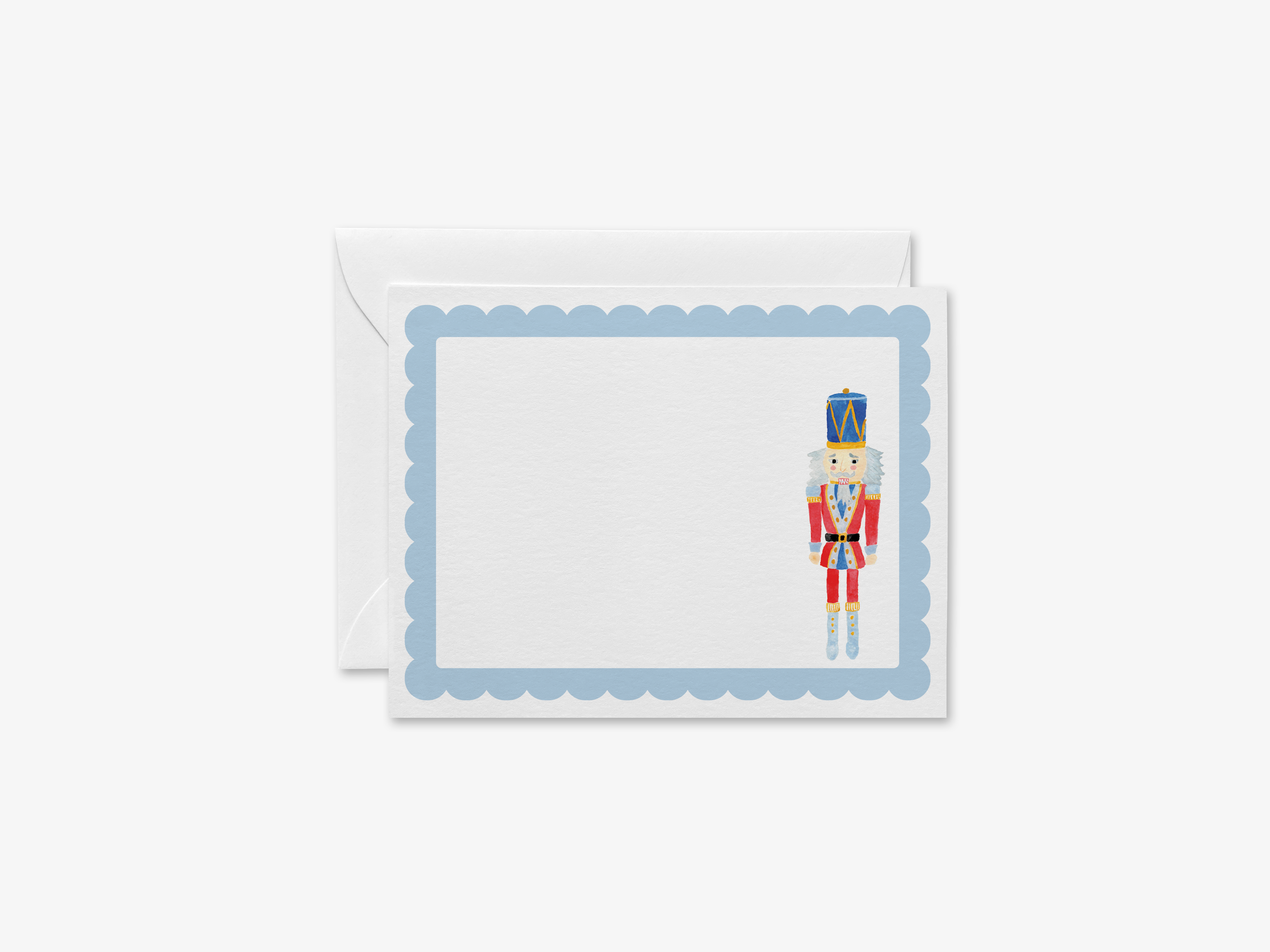 A greeting card with a nutcracker figure on the right side, set against a white background with a scalloped edge.