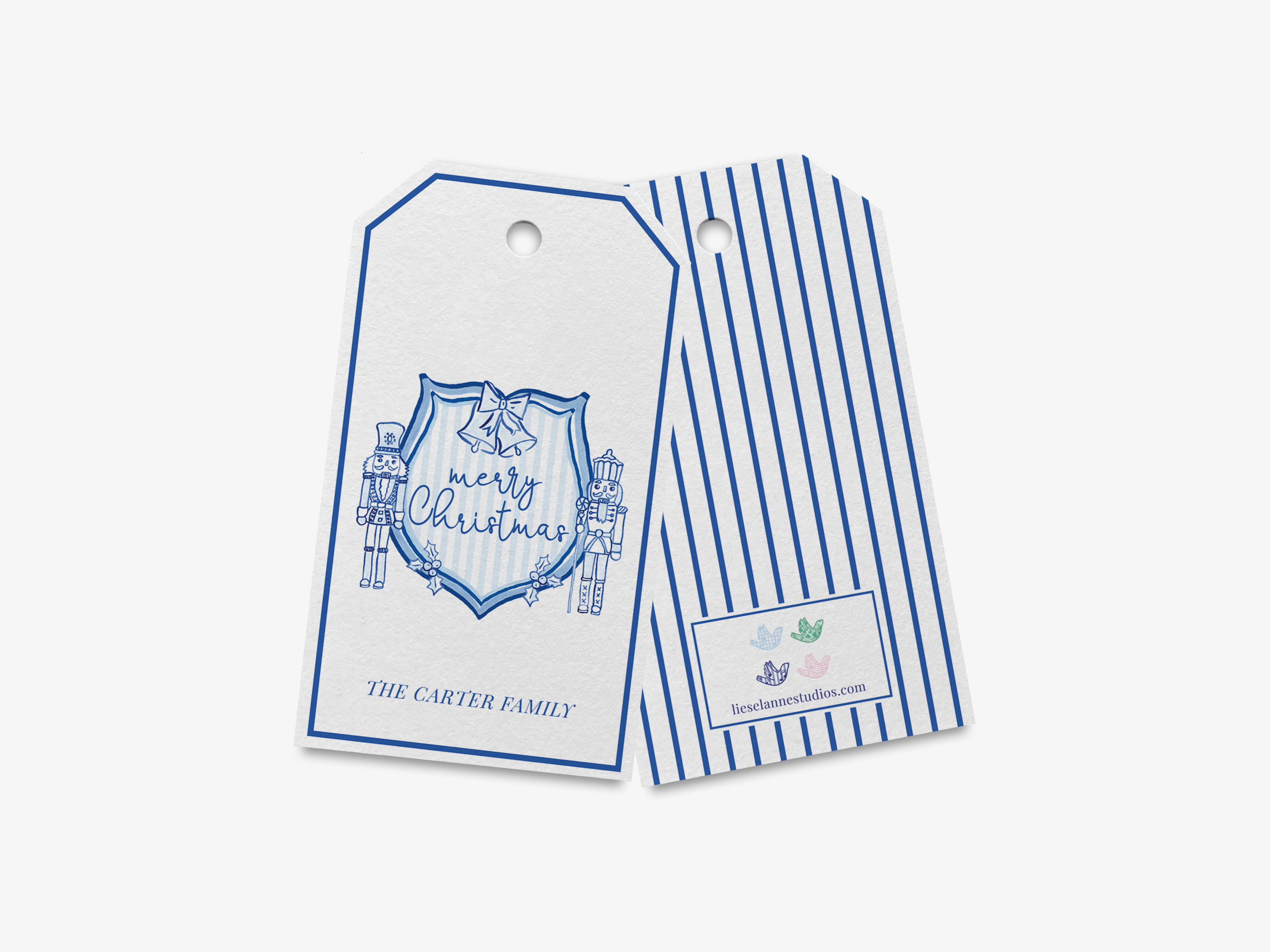two tags, one with a blue and white striped pattern and the other with a shield design, both displaying the text "Merry Christmas" and "The Carter Family".