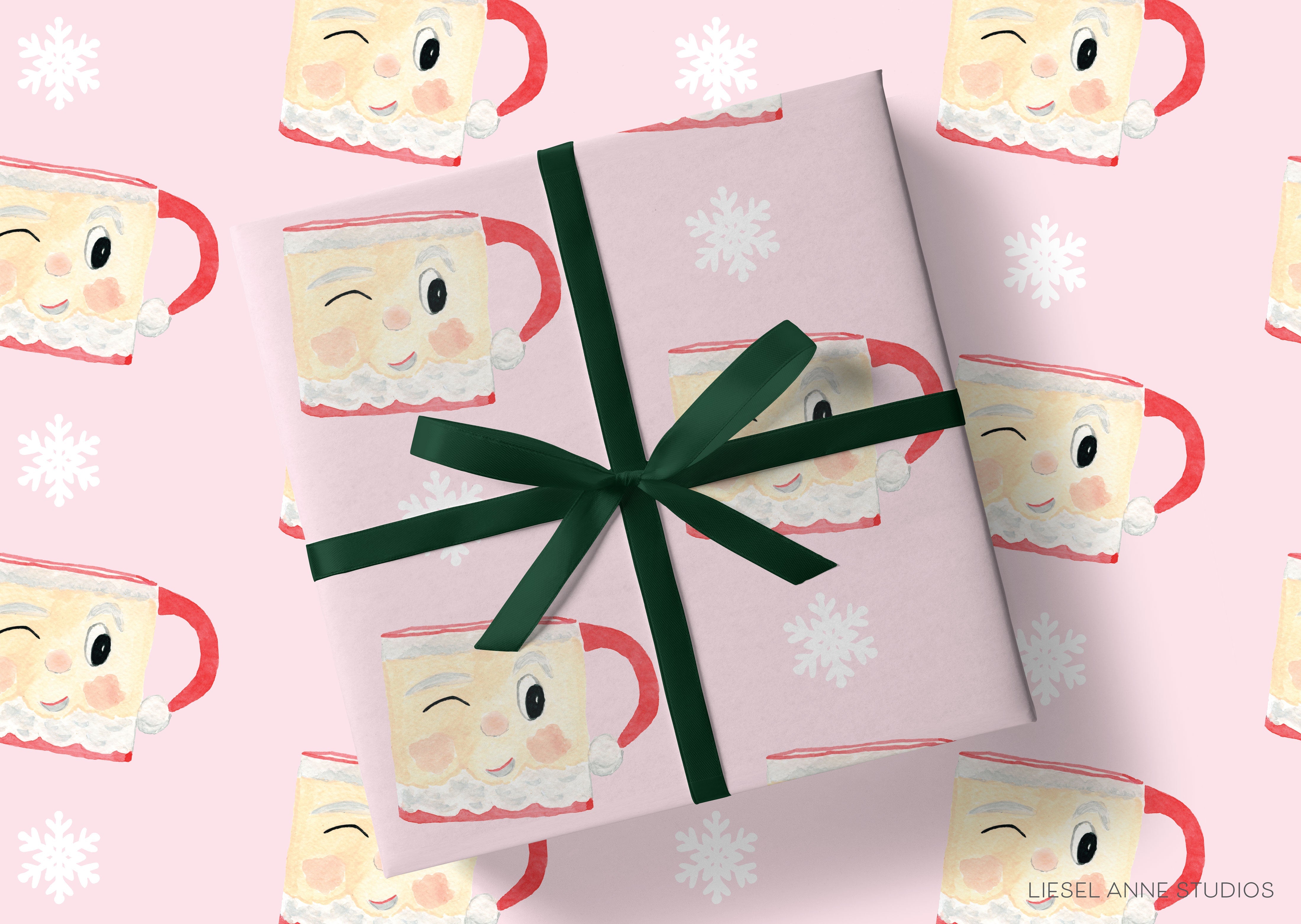 a gift wrapped in pink paper with a green ribbon, adorned with a repeating pattern of Santa Claus mugs.