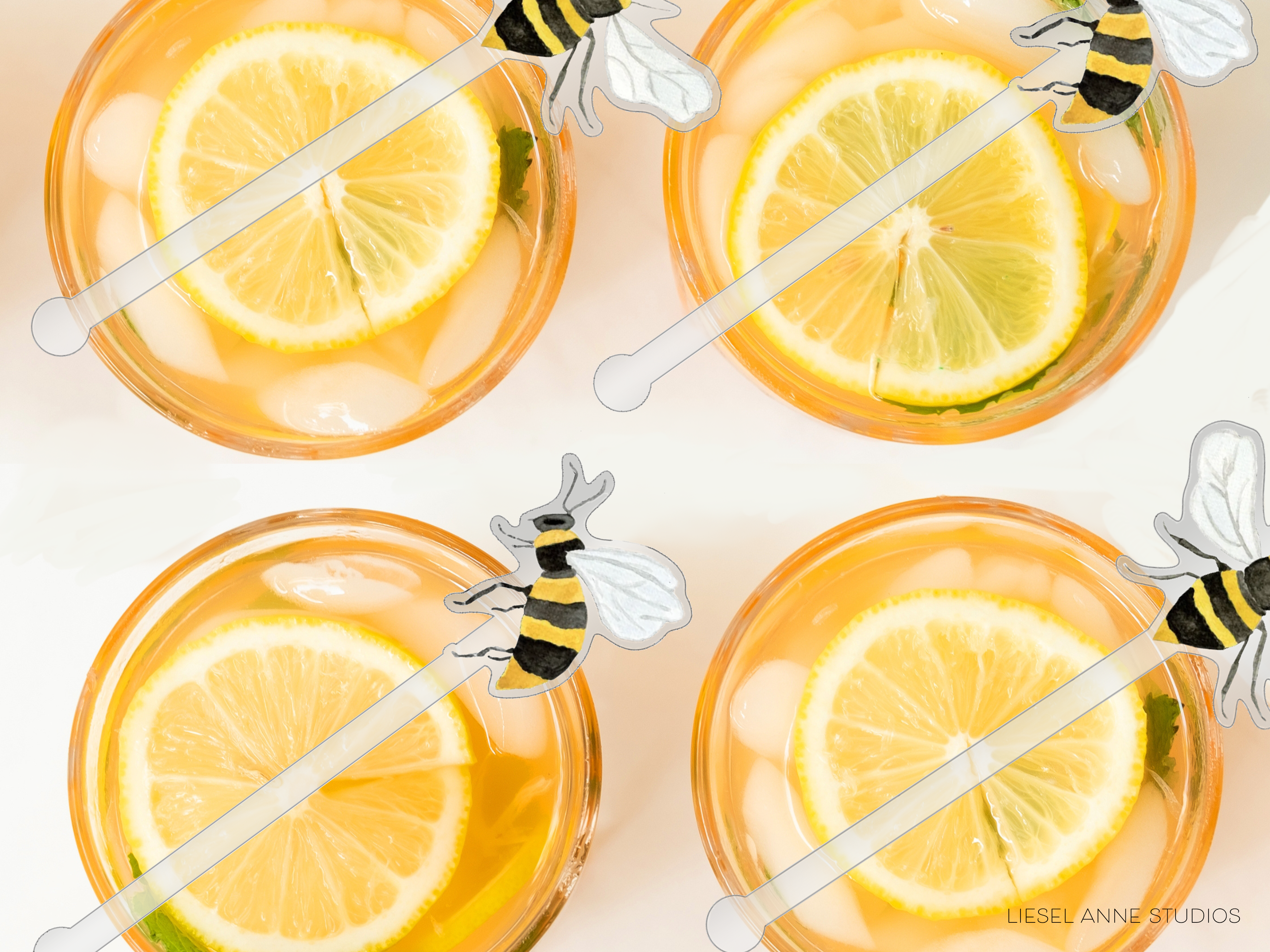 four glasses filled with a yellow liquid, each containing a slice of lemon and a bee-shaped straw.