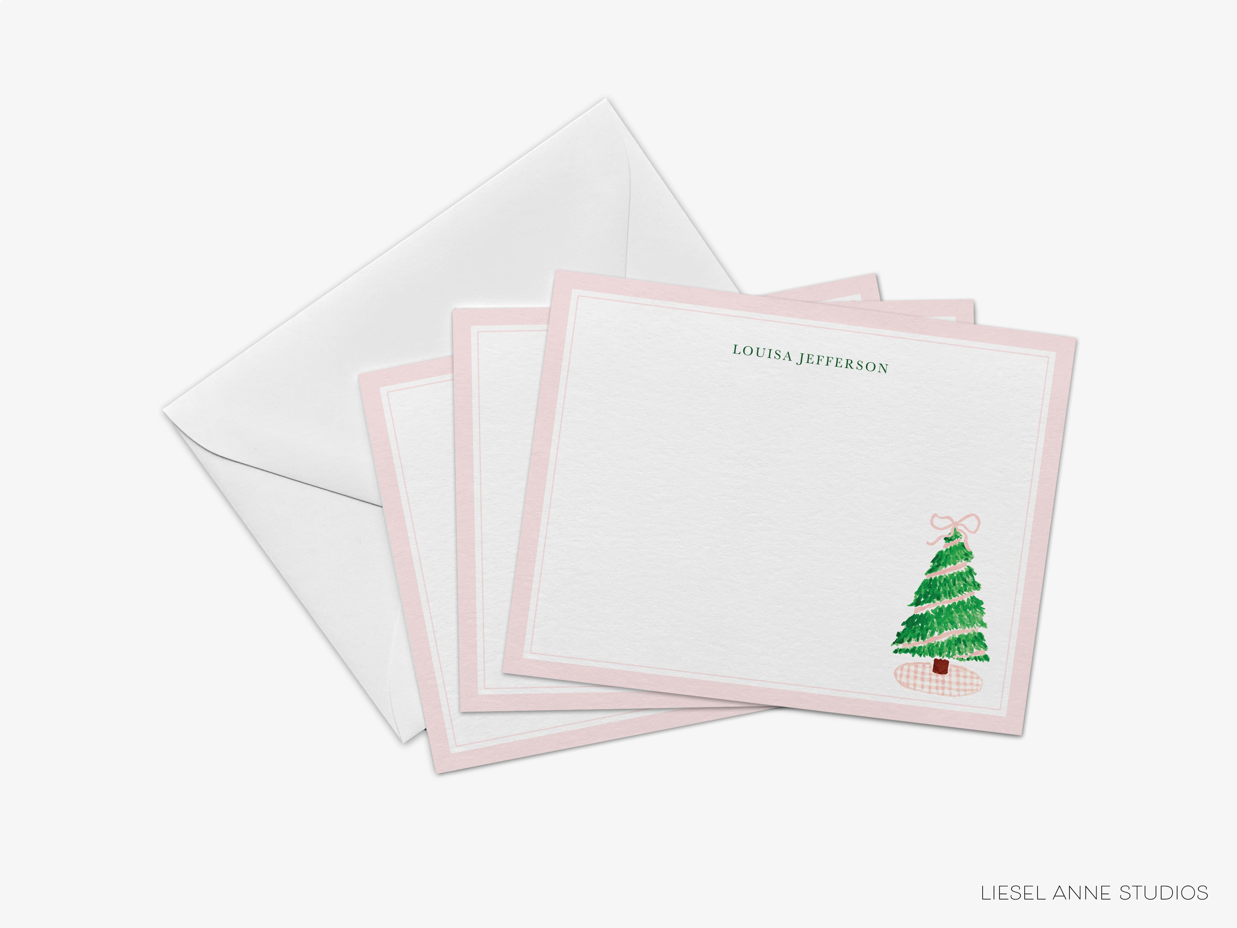 a set of personalized Christmas cards with a pink and white color scheme.