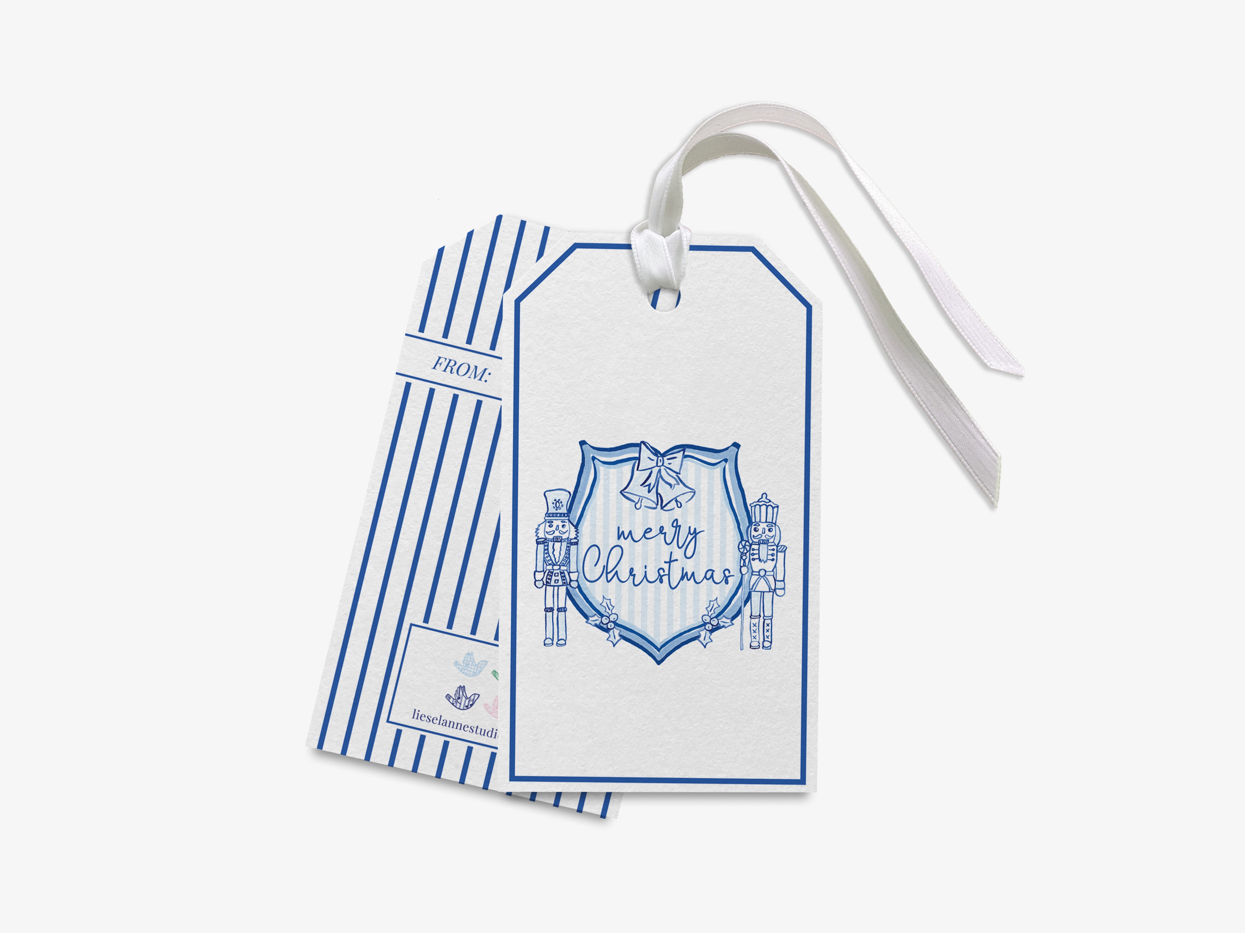 A white gift tag with blue stripes and a ribbon, featuring a design of a nutcracker and bells, along with the text "Merry Christmas".