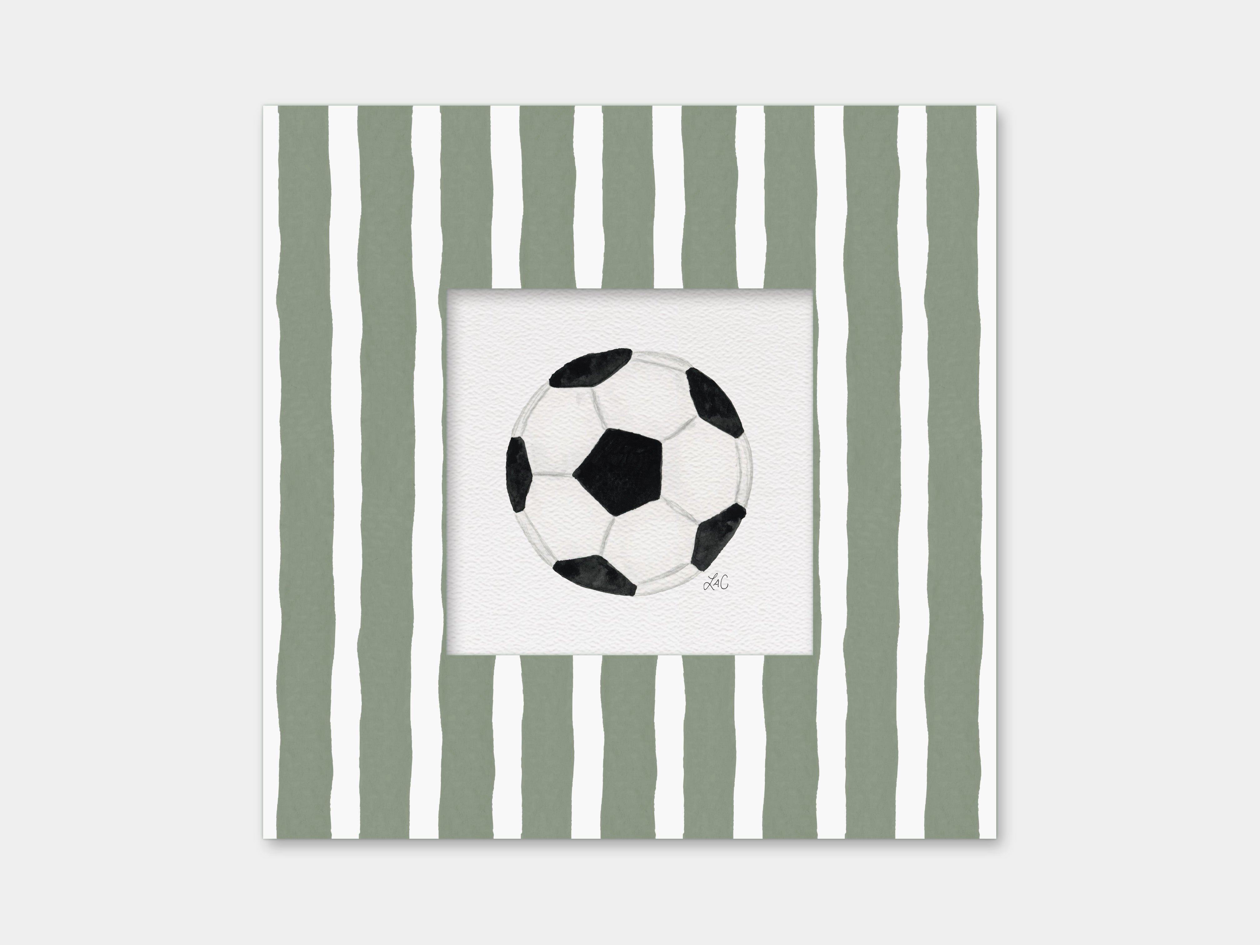 A framed image of a soccer ball against a background of green and white striped vertical lines.