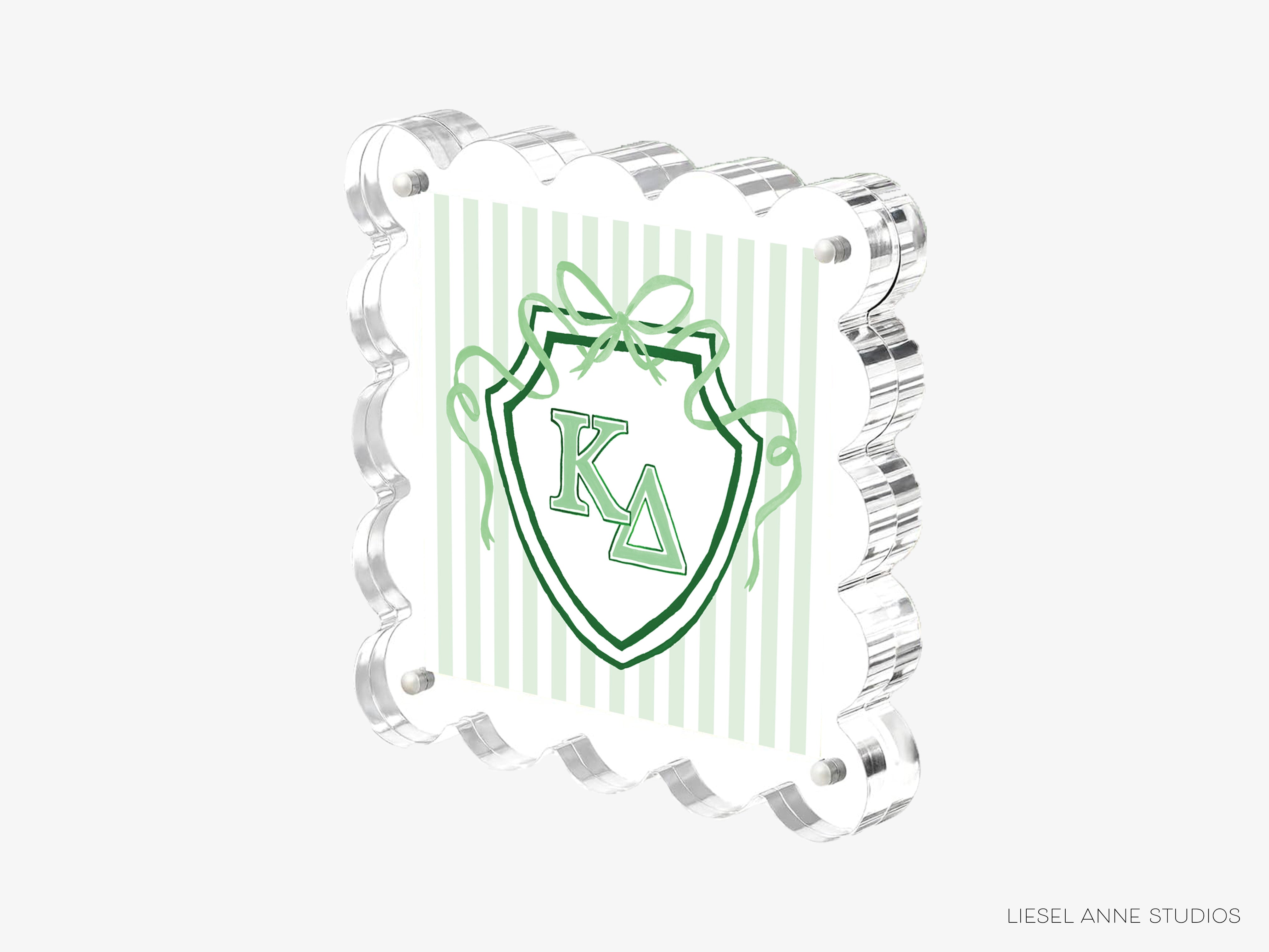 A 3D rendering of a shield-shaped object with a green and white striped pattern and a green ribbon design.