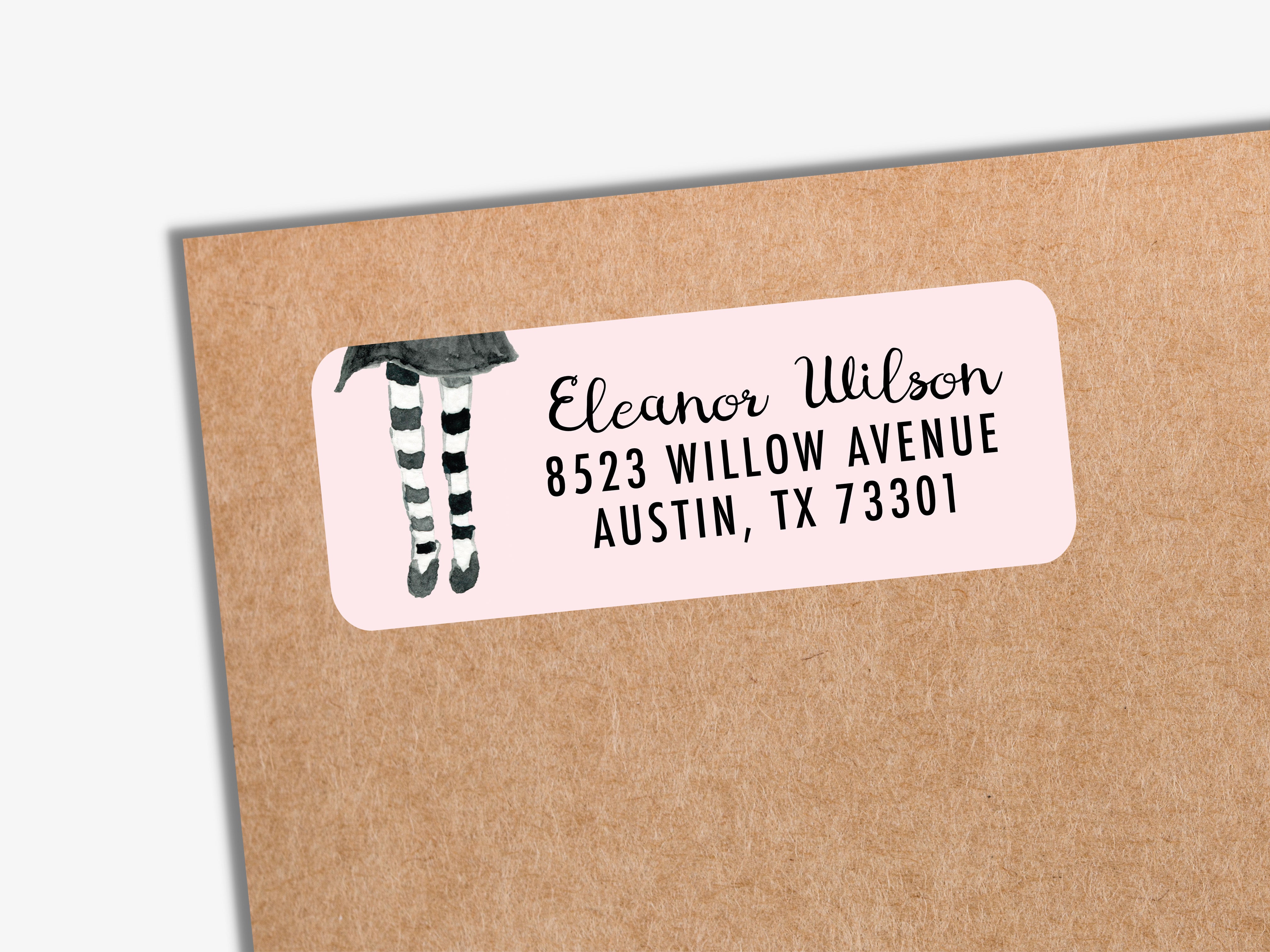 A pink envelope label with a black and white illustration of a person's legs and the text "Eleanor Wilson 8523 Willow Avenue Austin, TX 73001".