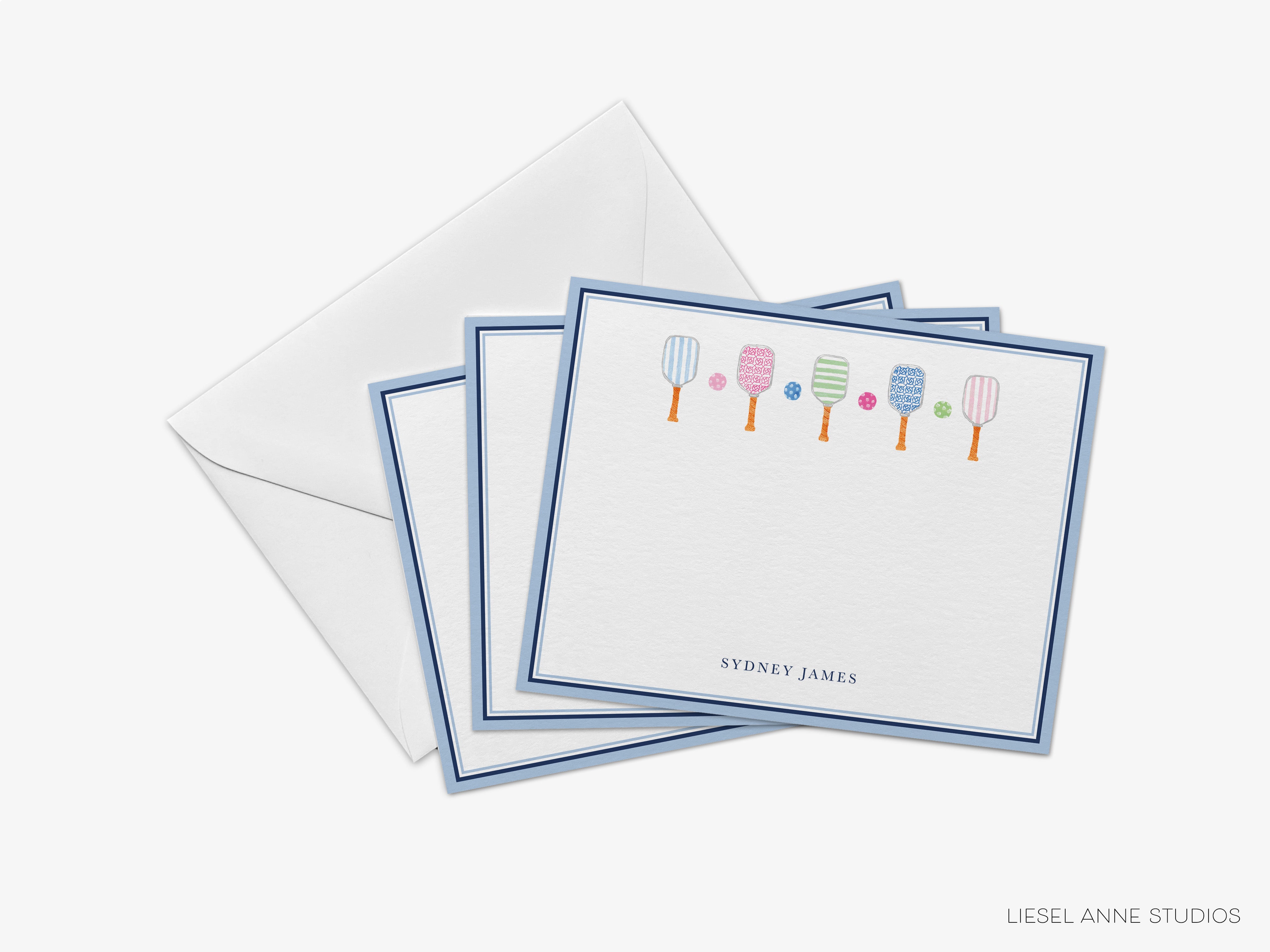 a set of personalized cards with illustrations of paddleboards and the name 'Sydney James' printed on them.