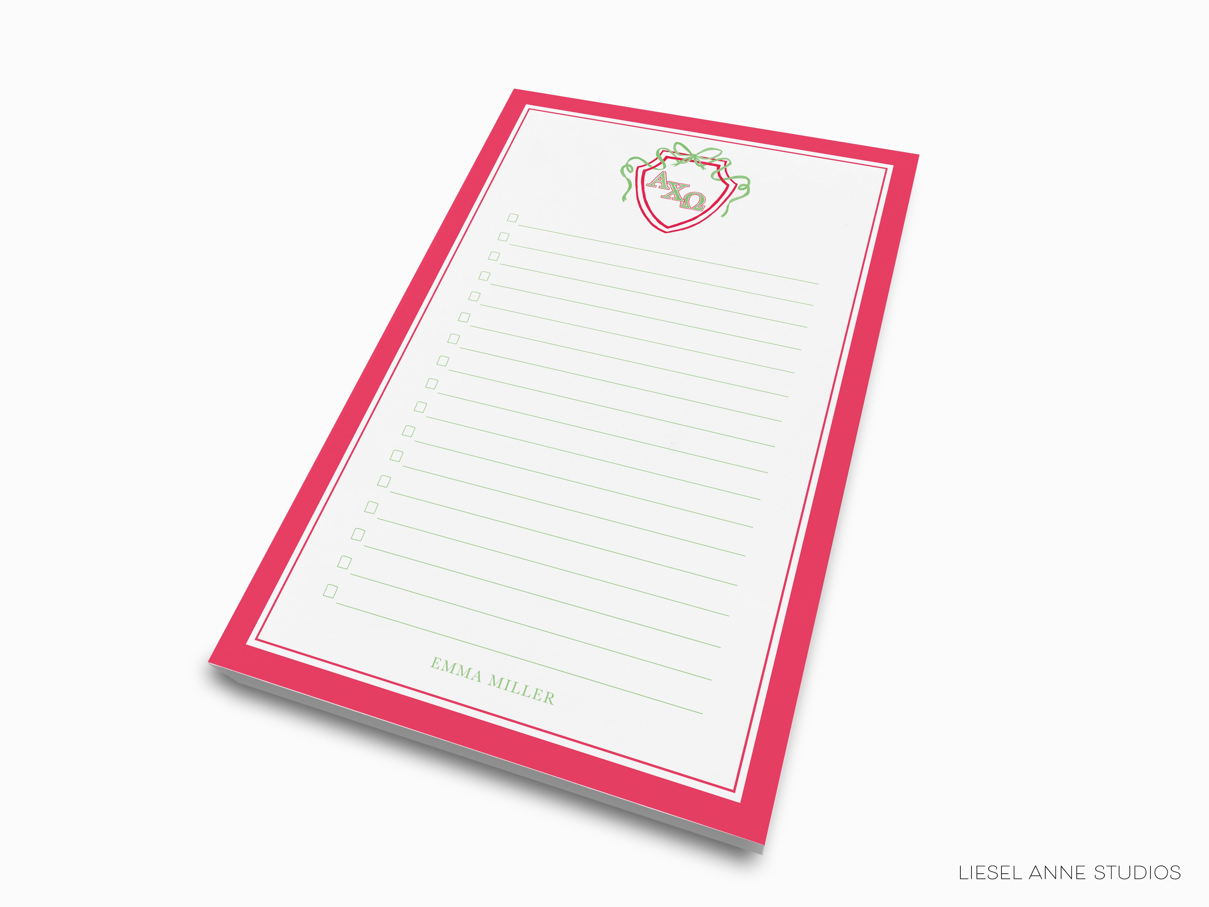 a pink and white notepad with a heart on it