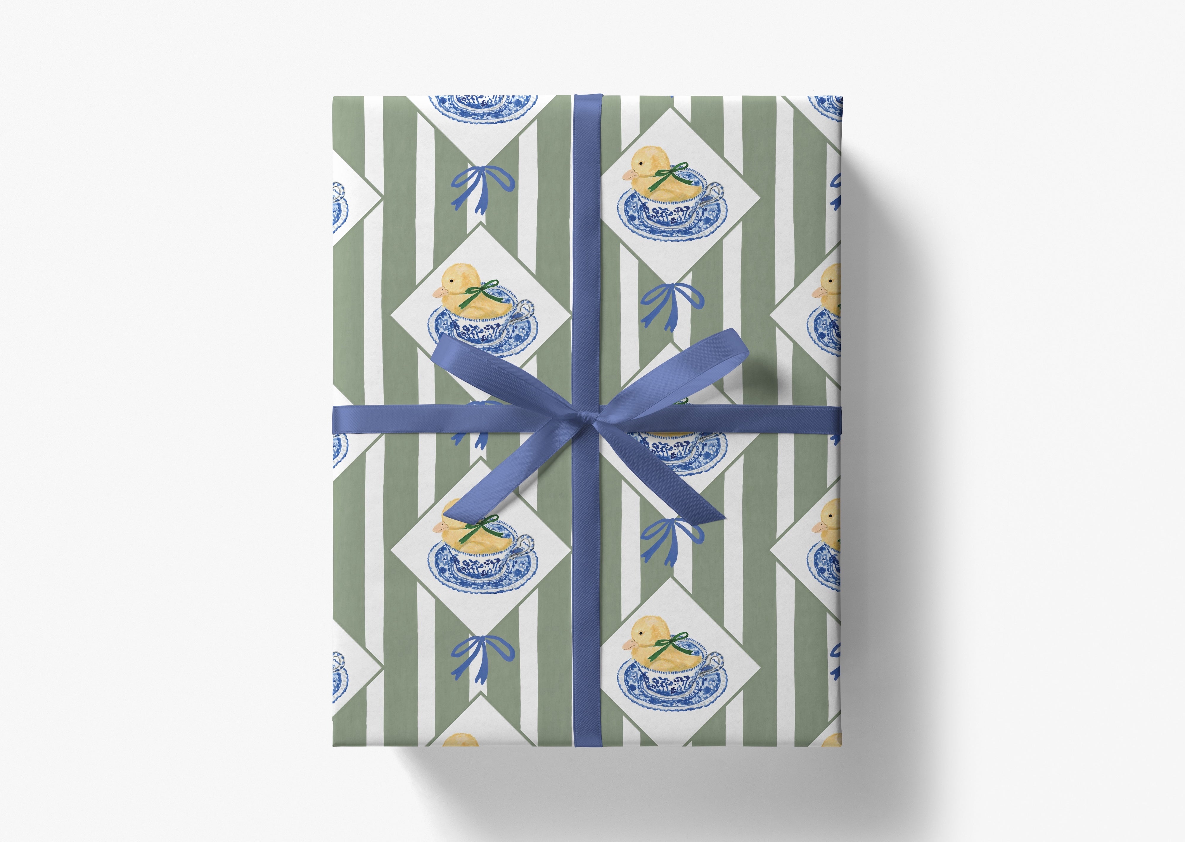 The image is a gift box wrapped in a blue ribbon, featuring a repeating pattern of blue and white duck illustrations on a green and white striped background.