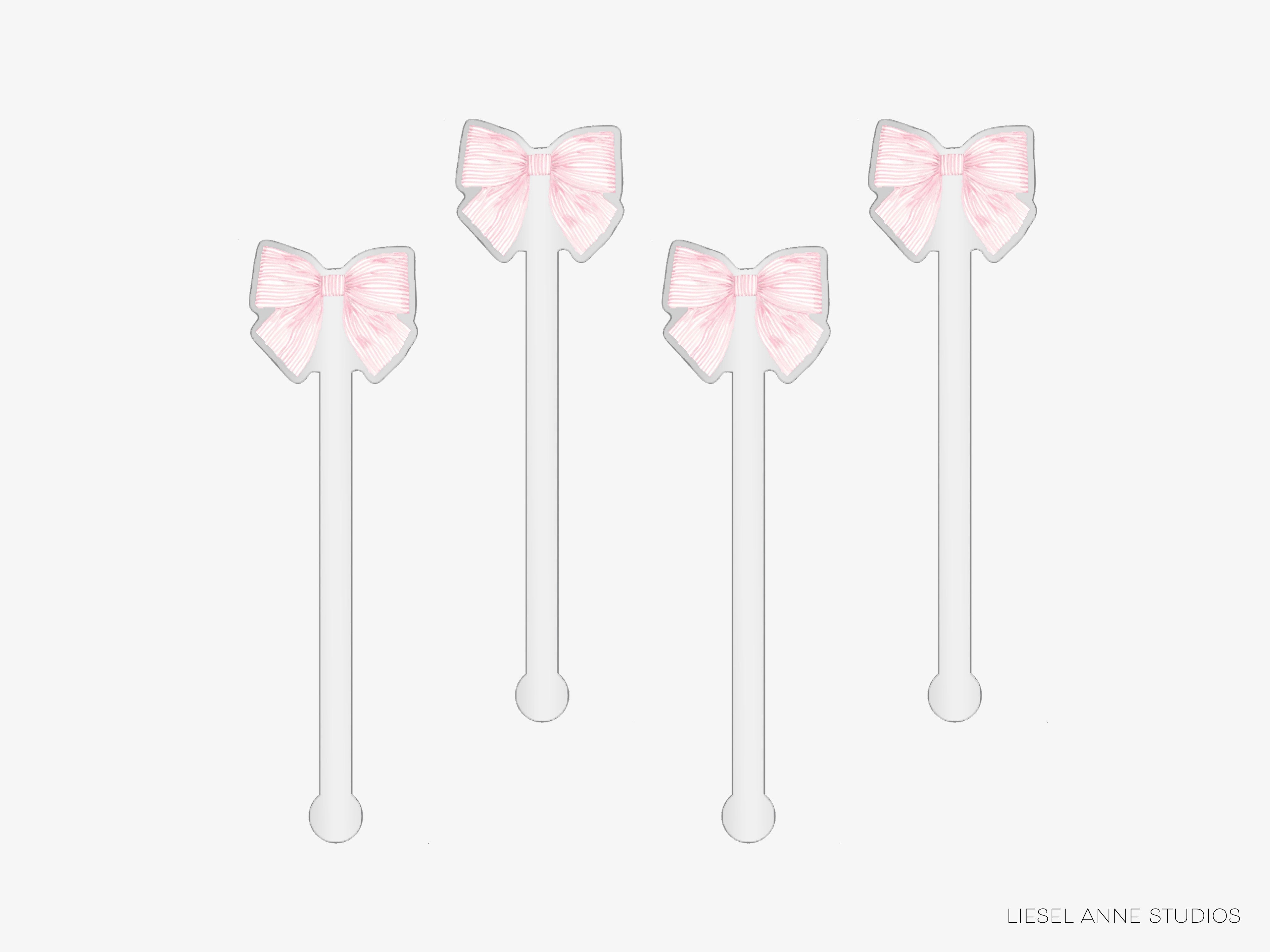 four pink bows on white sticks, arranged in a row.