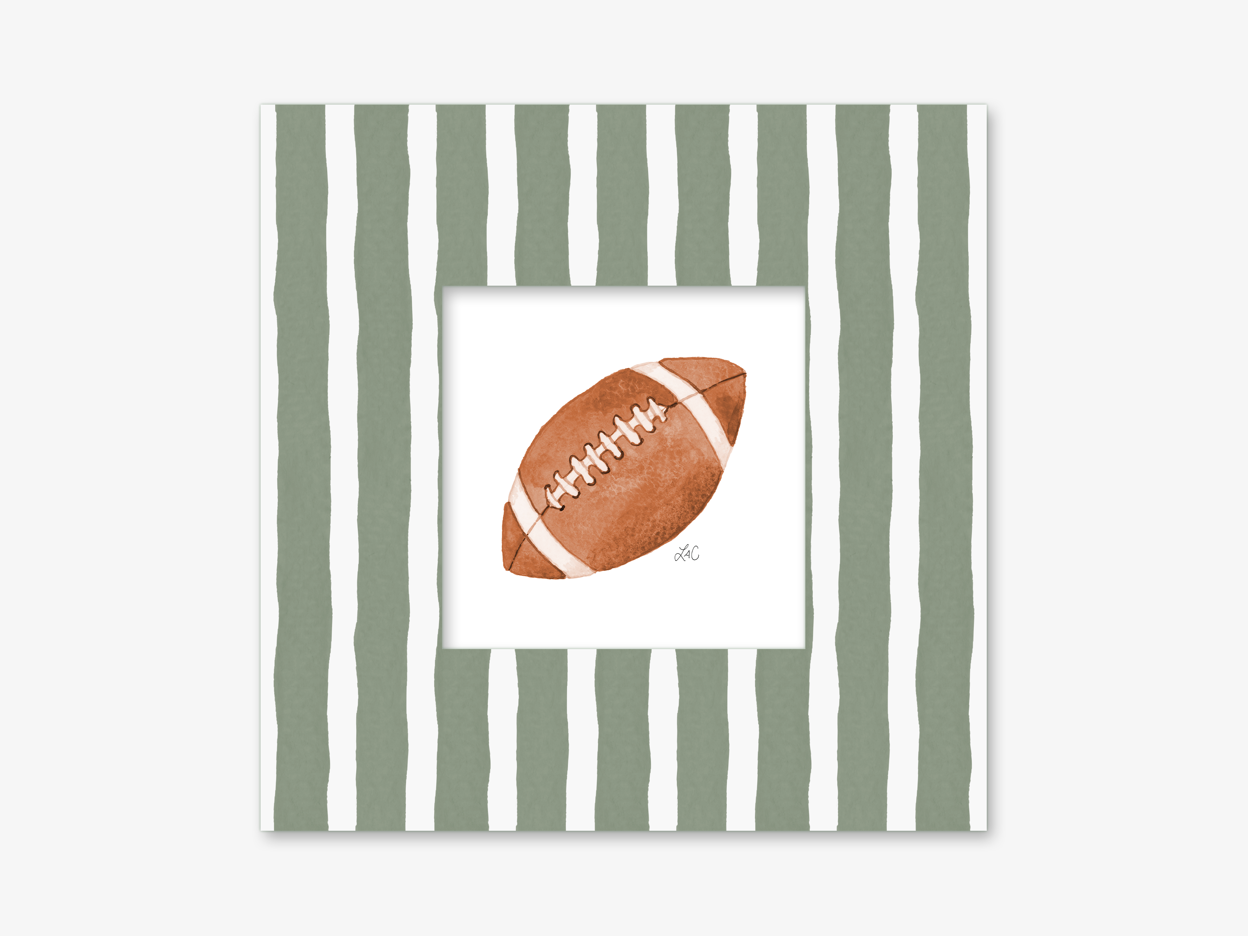 A framed image of a brown football with white stitching, set against a background of green and white striped vertical lines.