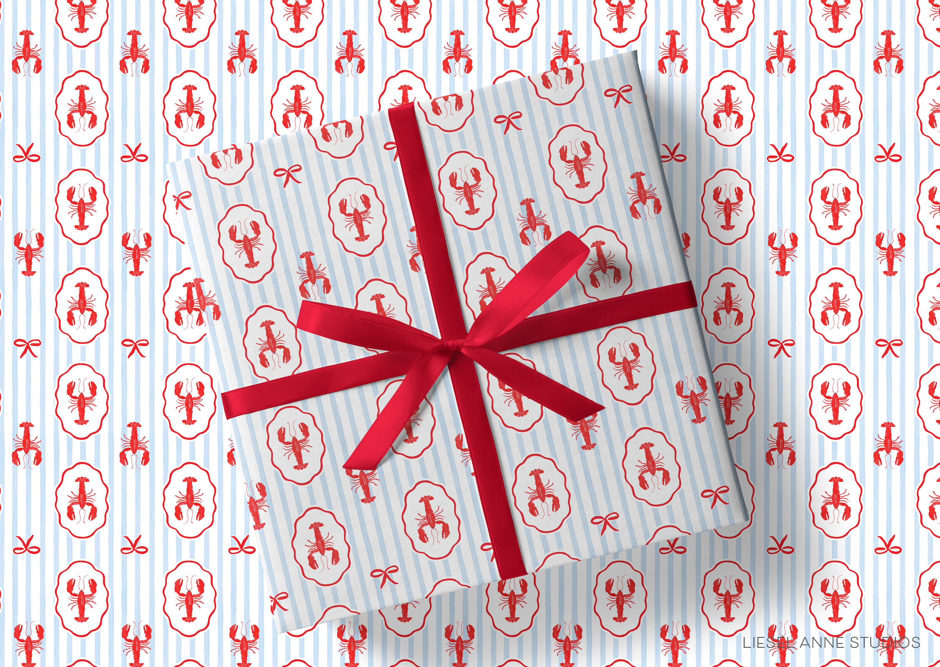 a wrapped gift box with a red ribbon