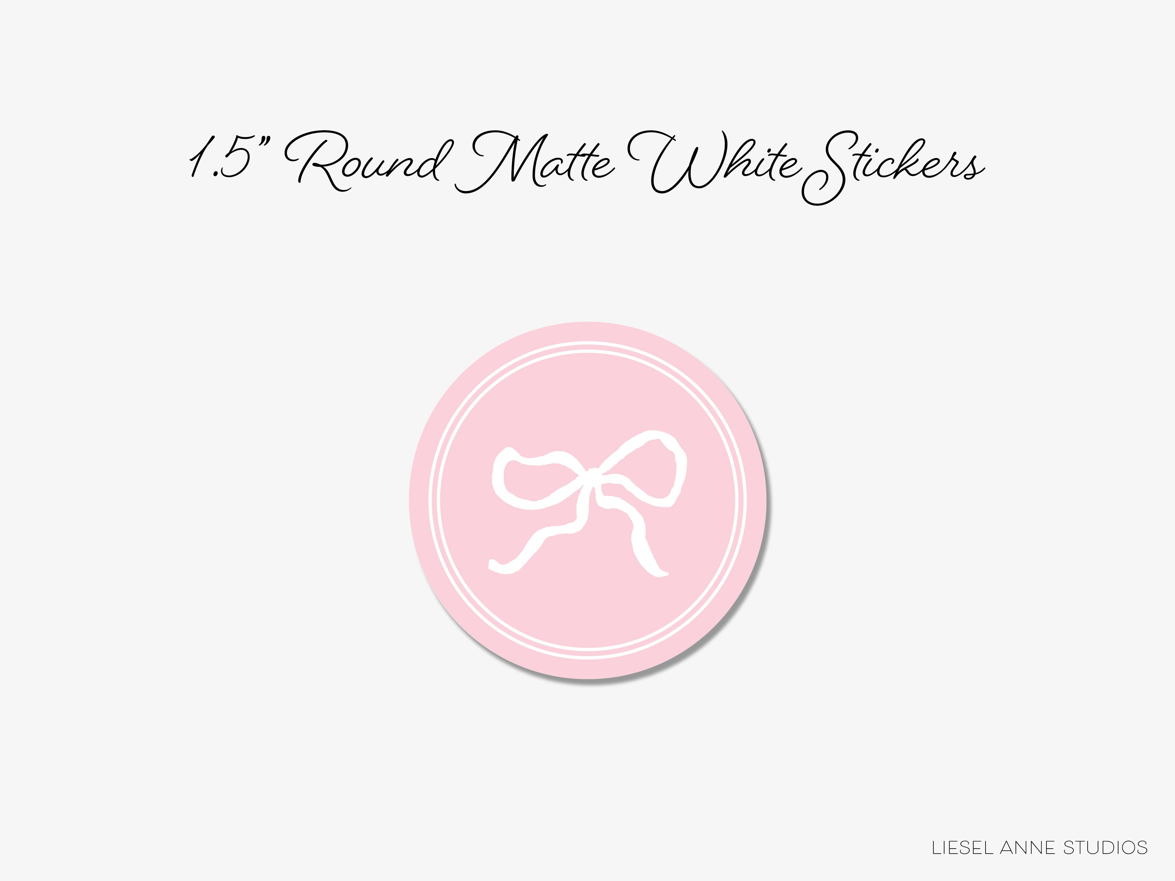 a pink button with a white bow on it
